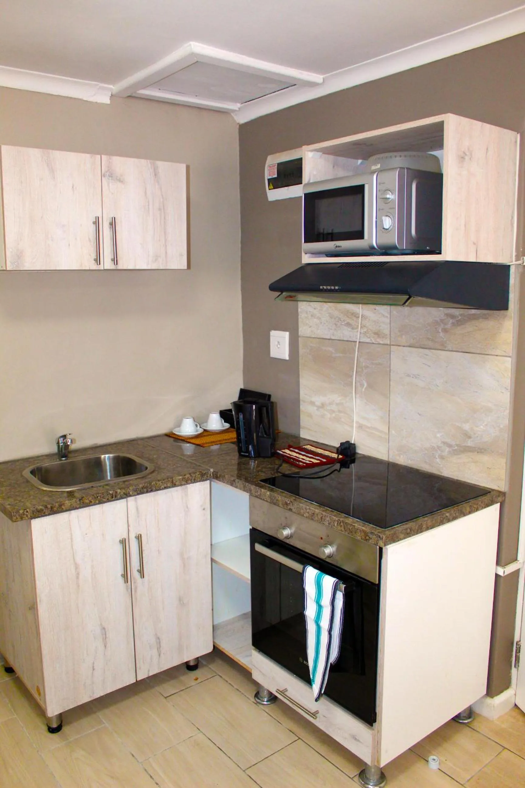 Kitchen or kitchenette in 103onWallace Self Catering Guest House