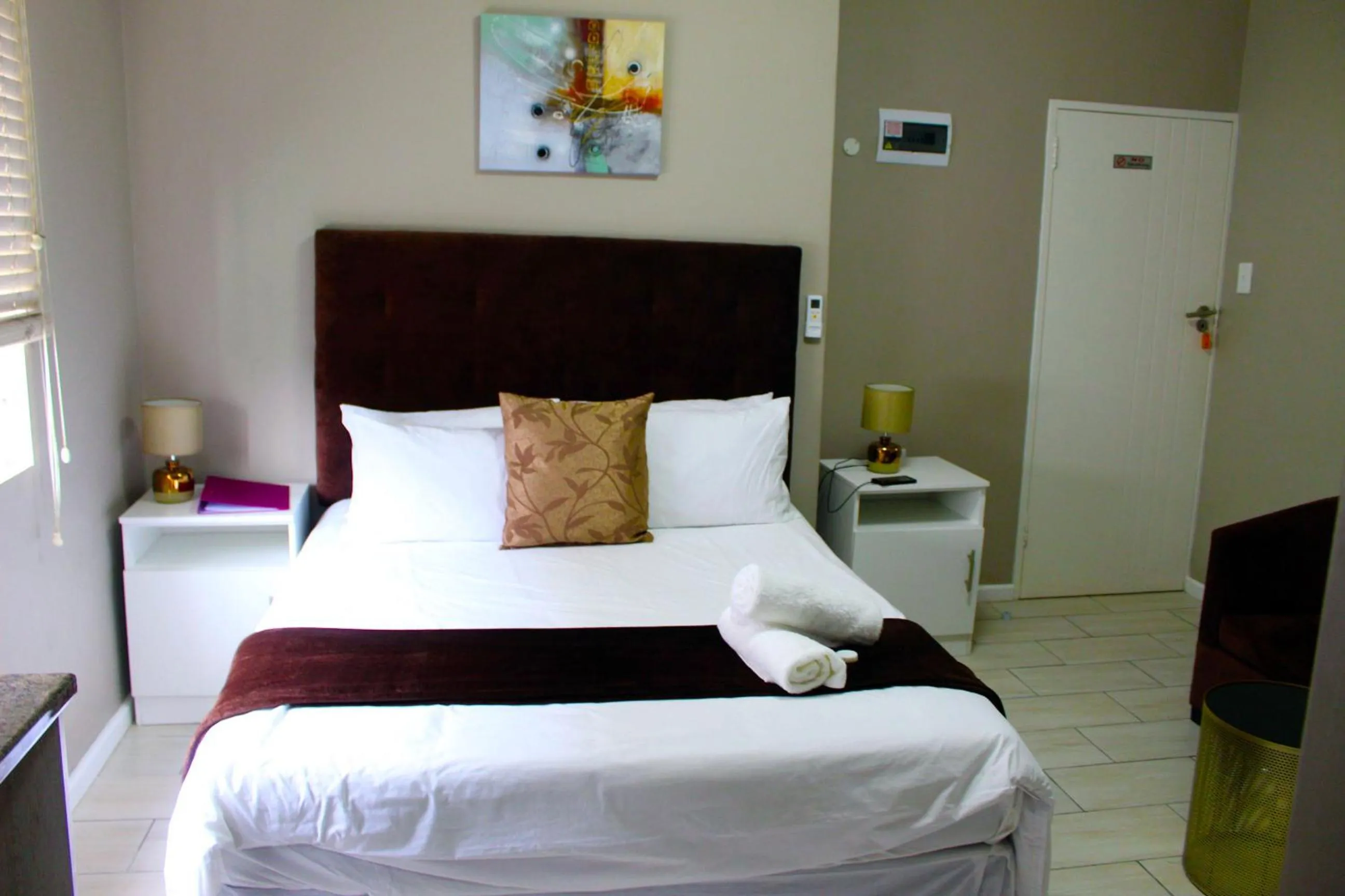 Bed in 103onWallace Self Catering Guest House