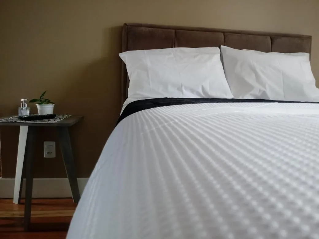 Bed in Pousada Toscana Cambará