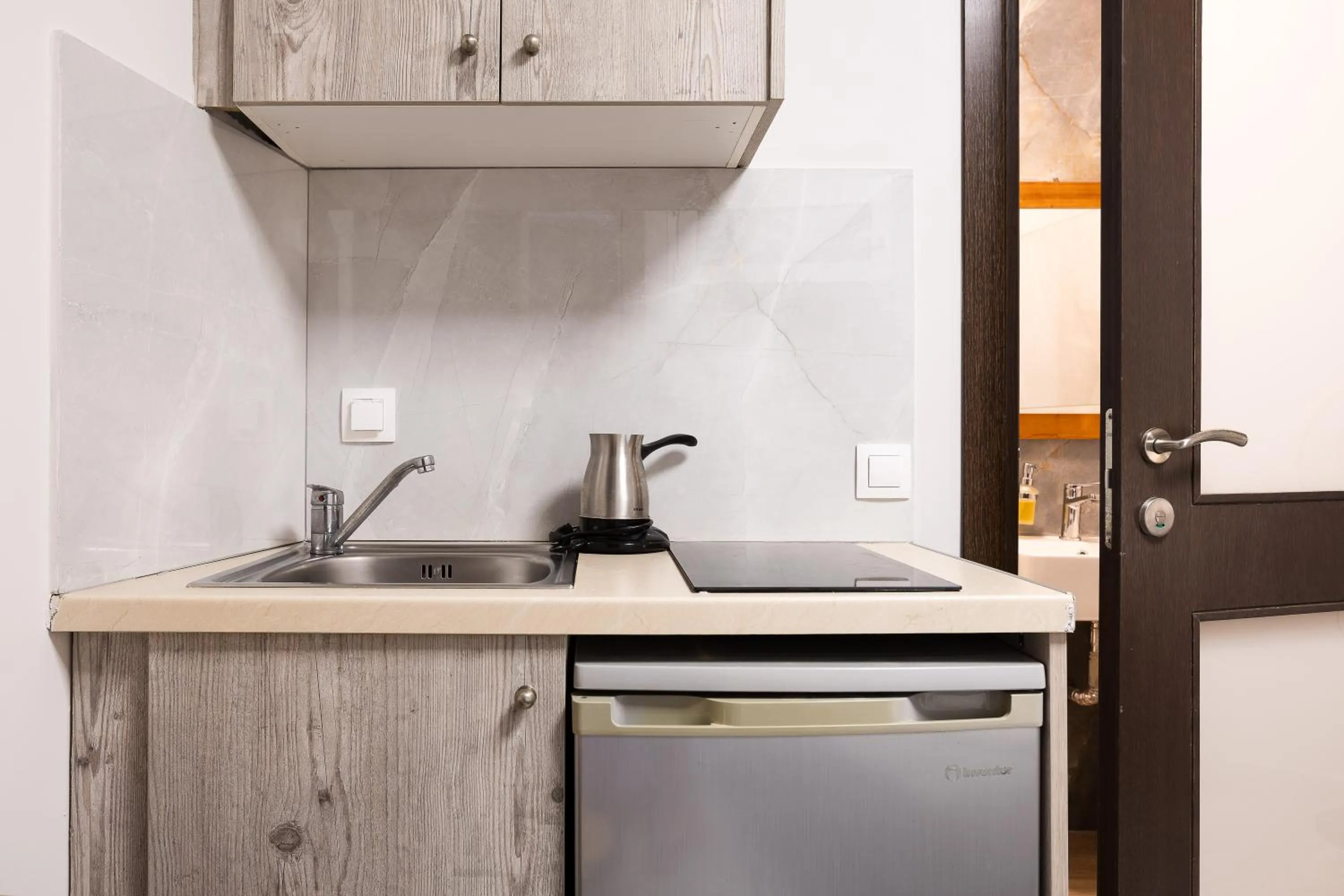 Kitchen or kitchenette in Akrogiali Apartments