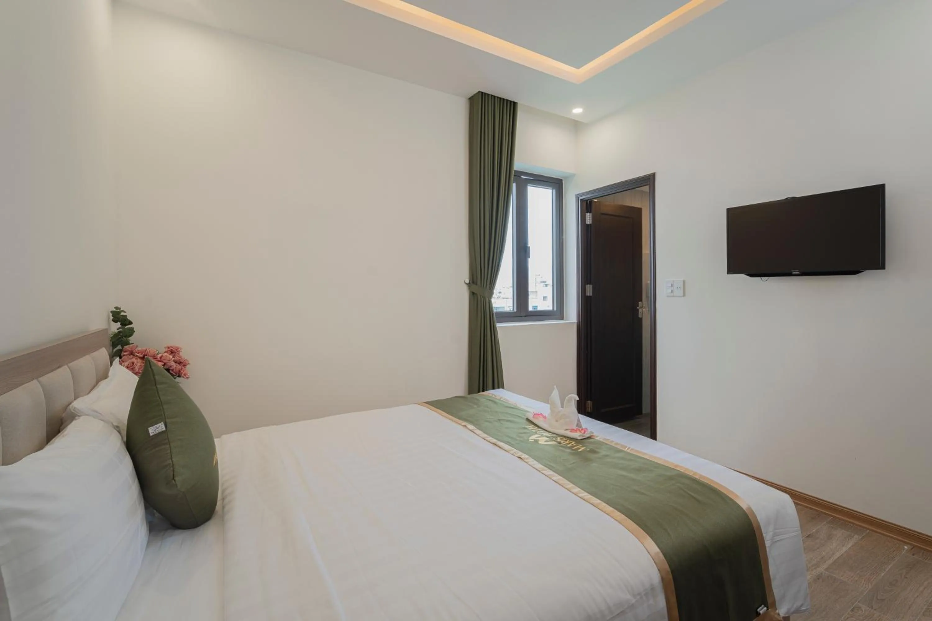 Communal lounge/ TV room, Bed in Maris Da Nang Hotel & Apartment