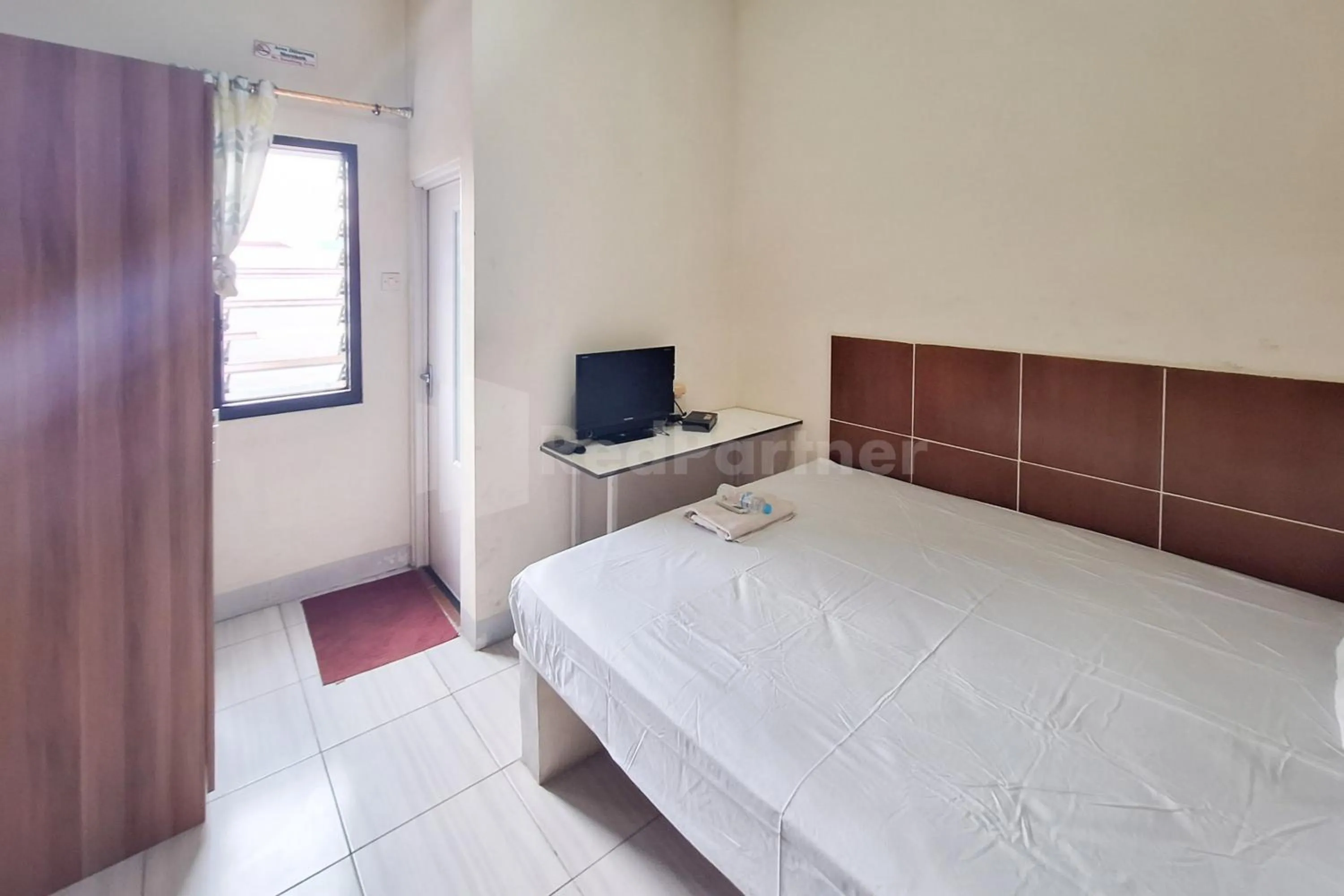 Bed in Joy Homestay At Pulomas RedPartner