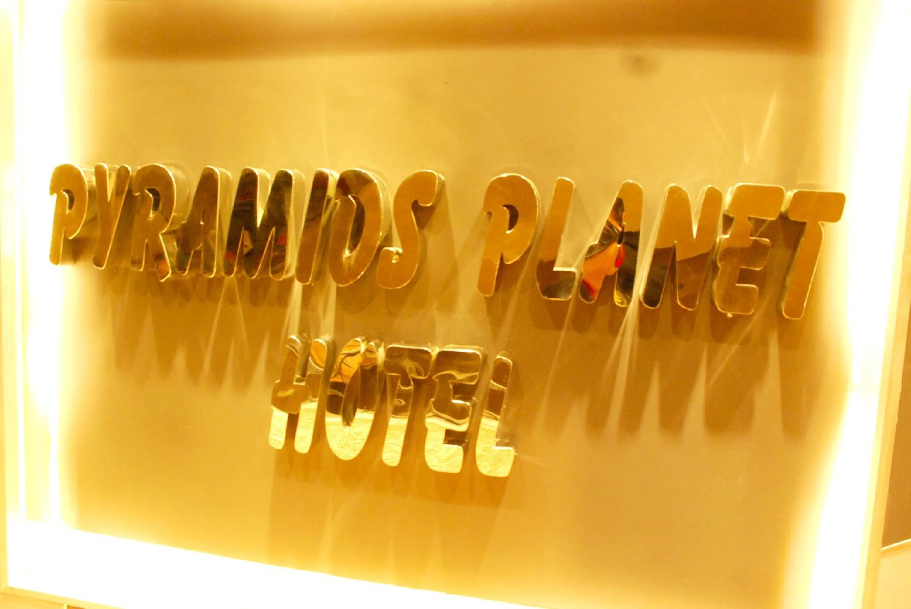 Property logo or sign in Pyramids Planet Hotel