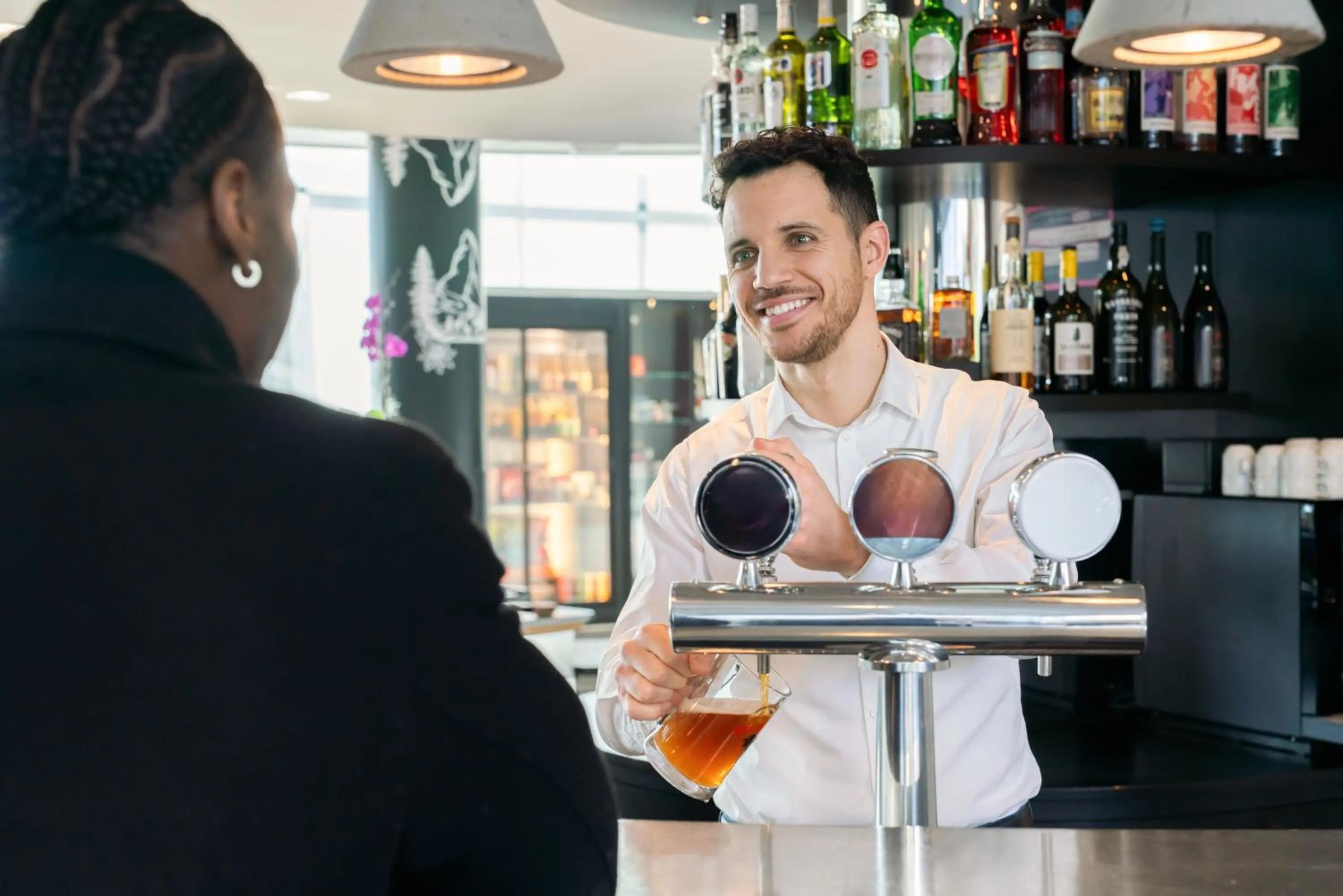 Lounge or bar in Novotel Suites Genève Aéroport