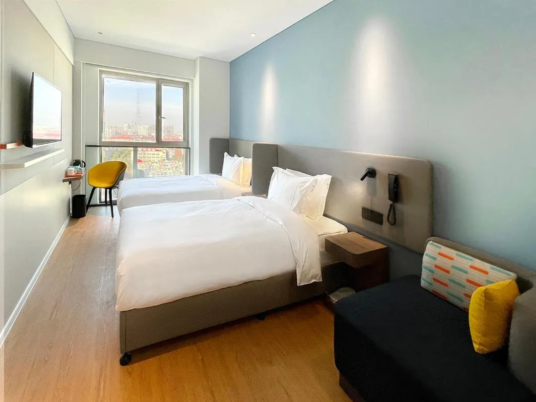 Bed in Holiday Inn Express Shanghai Baoyang by IHG