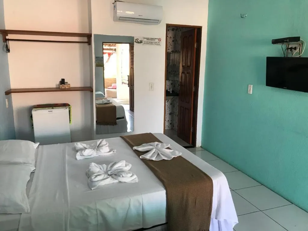 Bed in Pousada Numei de Jeri