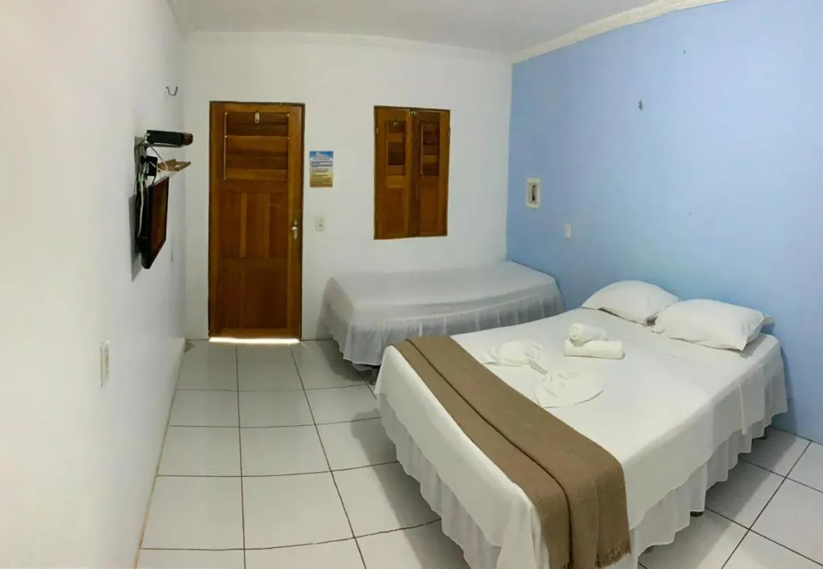 Bed in Pousada Numei de Jeri