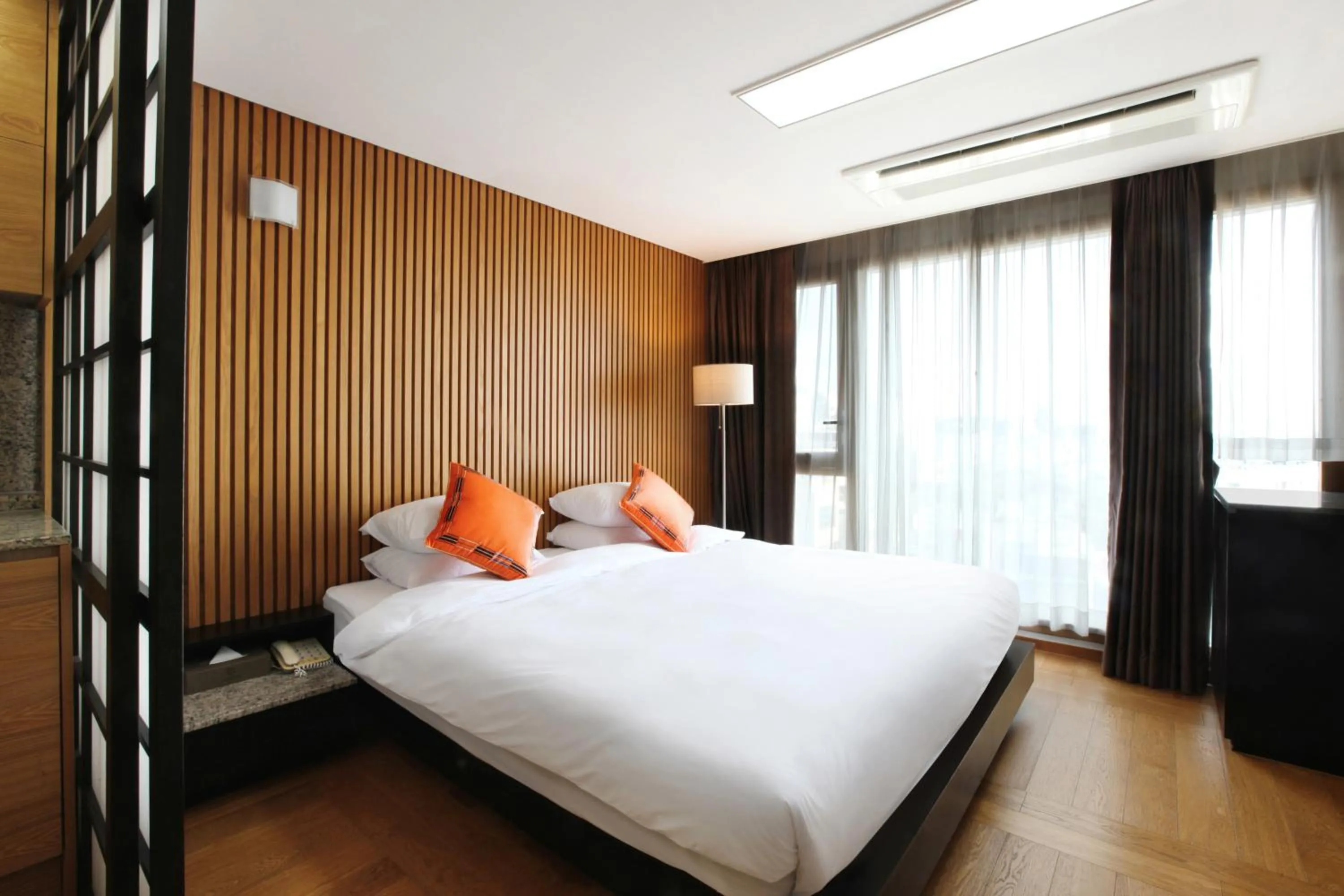 Decorative detail, Bed in Shin Shin Hotel Jeju Ocean