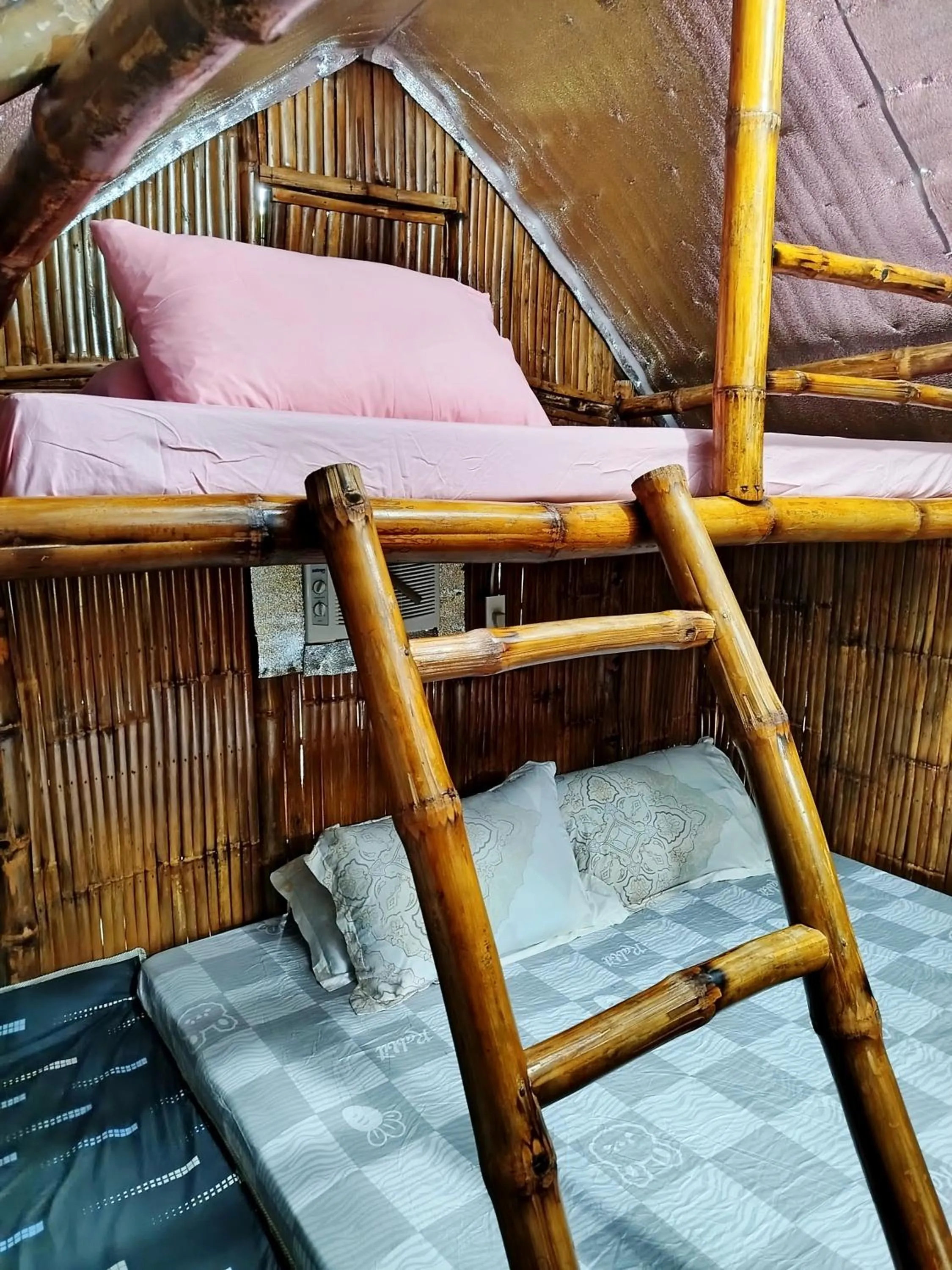 Bed in Rea's Bamboo Resort