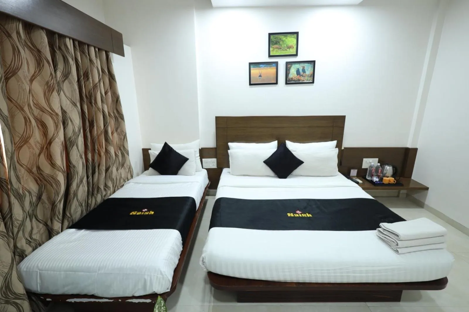 Photo of the whole room, Bed in Saish Hotel Shirdi