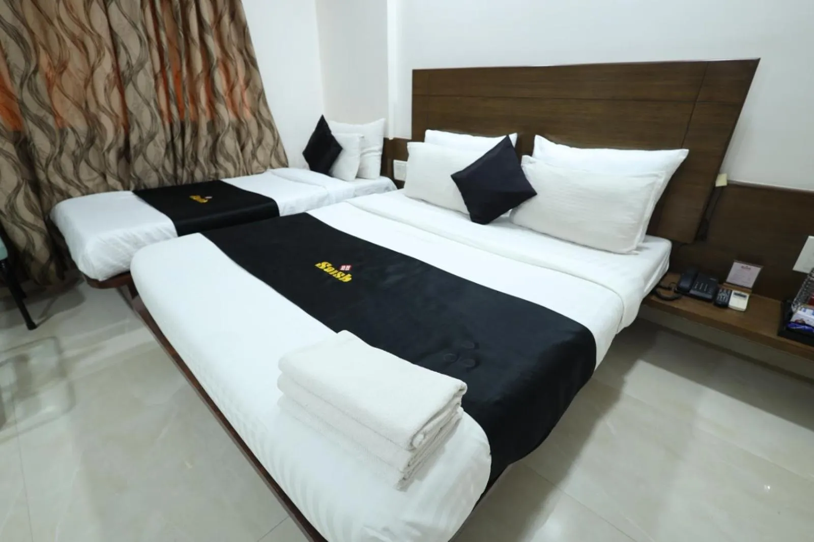 Bed in Saish Hotel Shirdi