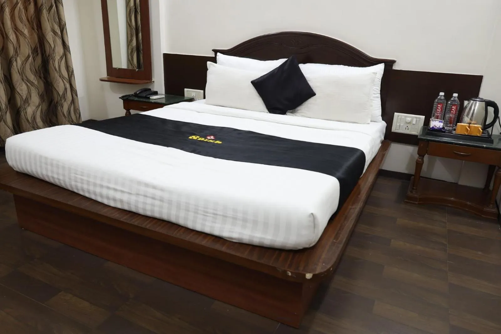 Photo of the whole room, Bed in Saish Hotel Shirdi