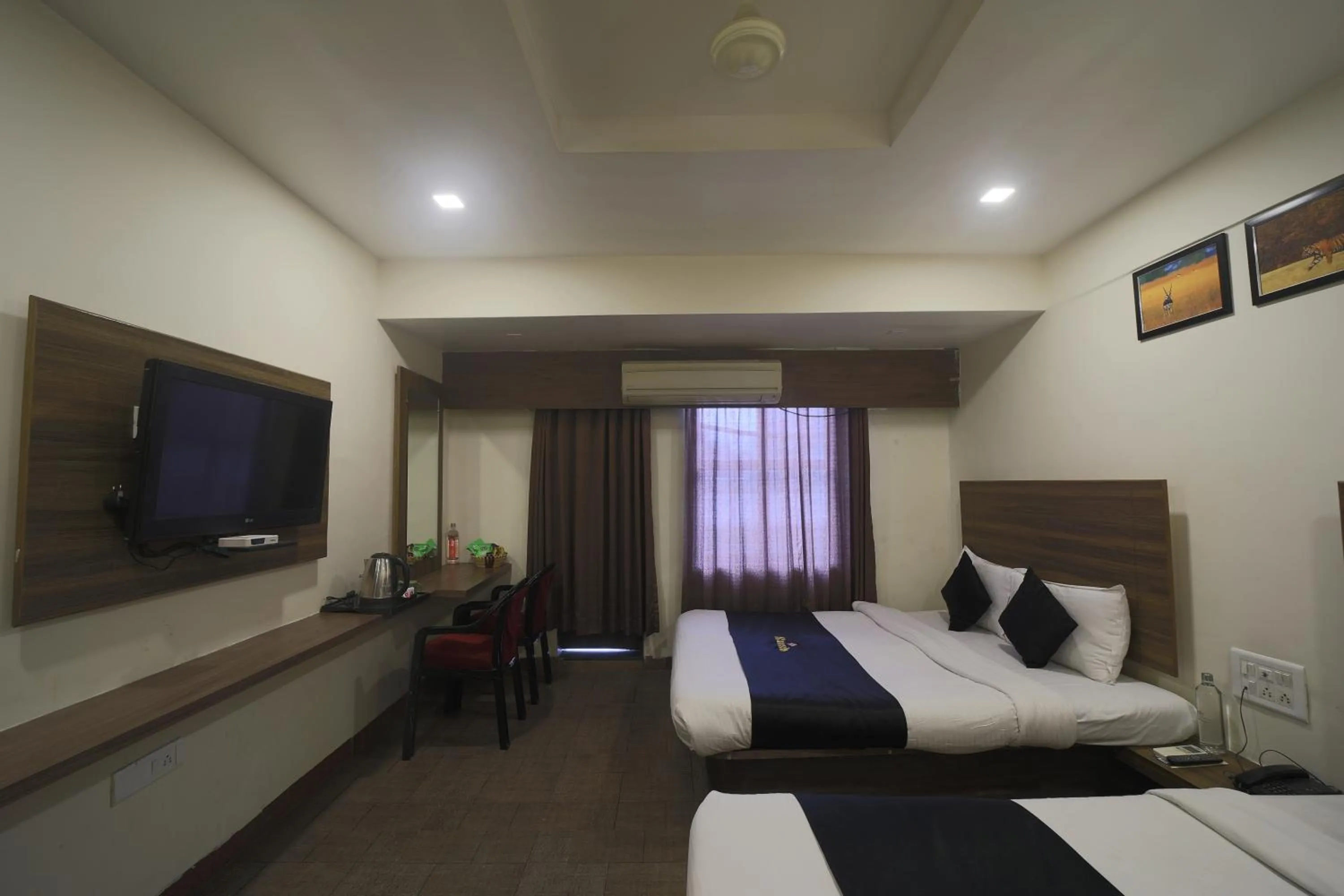 Property building, Bed in Saish Hotel Shirdi