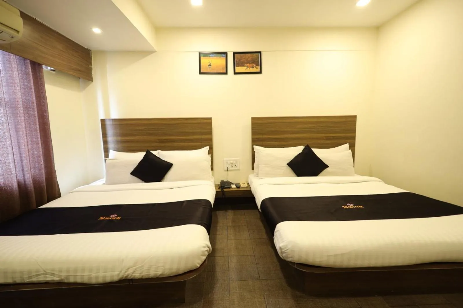 Bed in Saish Hotel Shirdi