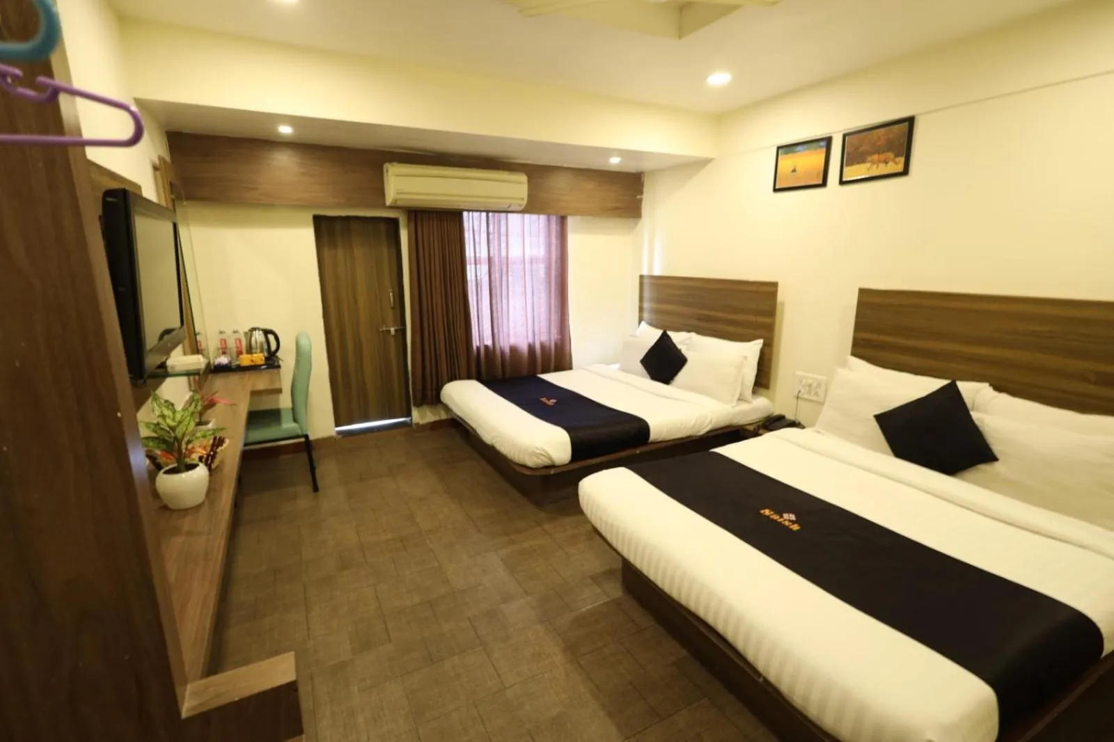 Bedroom, Bed in Saish Hotel Shirdi