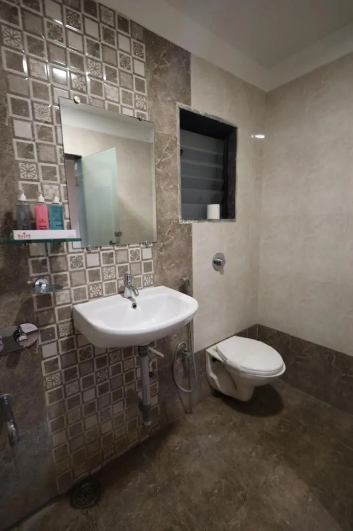 Toilet in Saish Hotel Shirdi