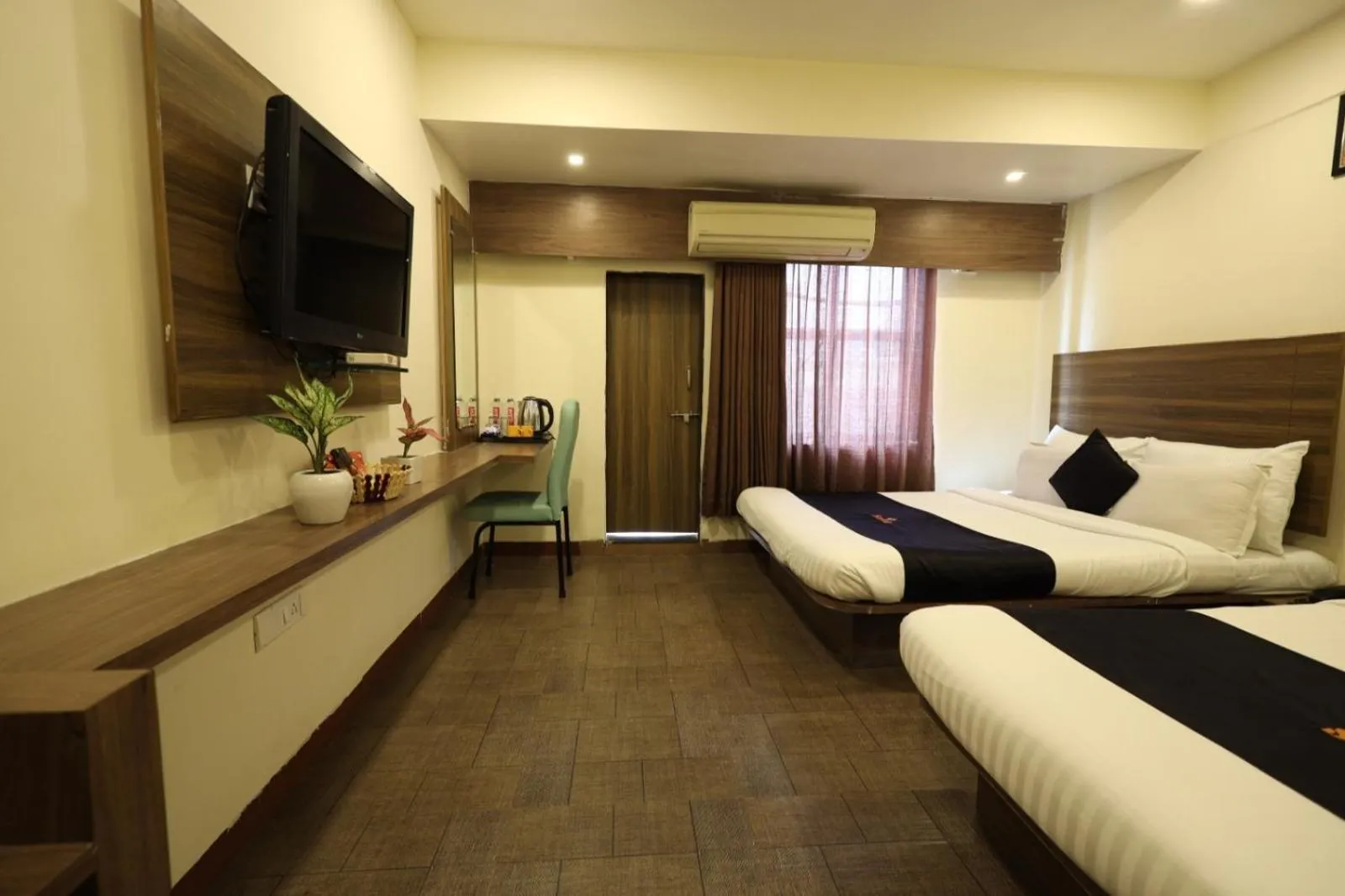Bed in Saish Hotel Shirdi