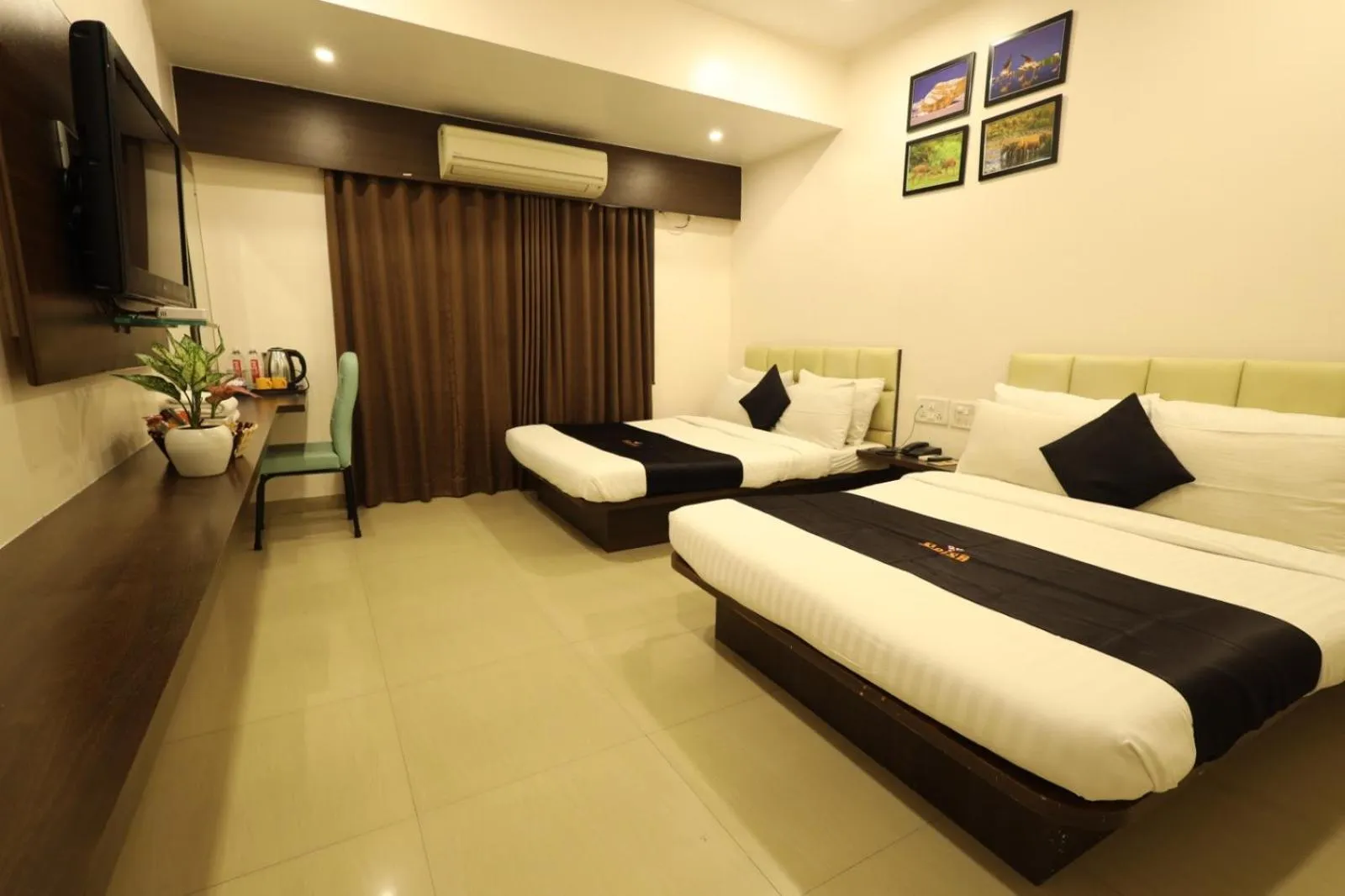 Photo of the whole room, Bed in Saish Hotel Shirdi