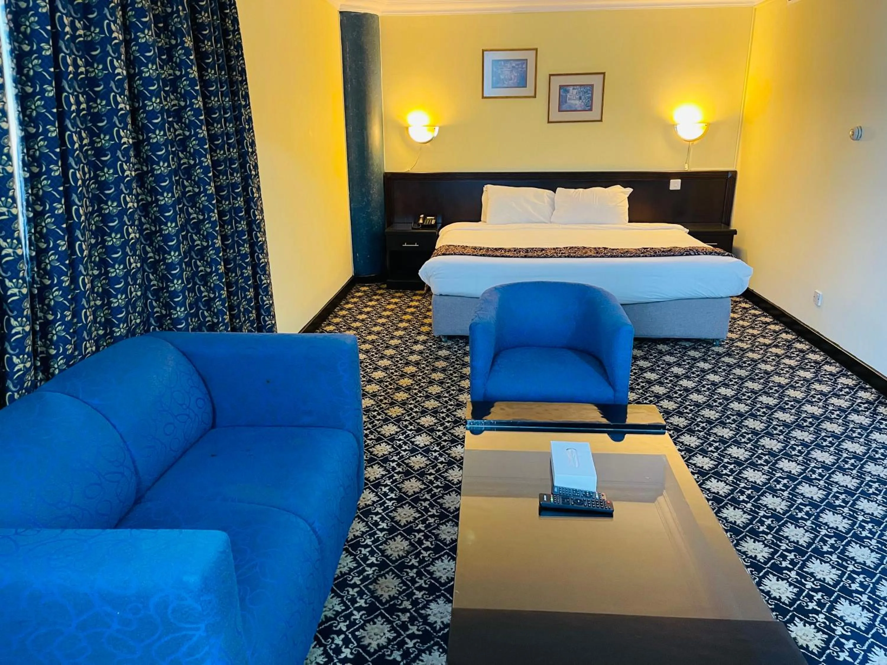 Seating area, Bed in Phoenicia Tower Hotel And Spa