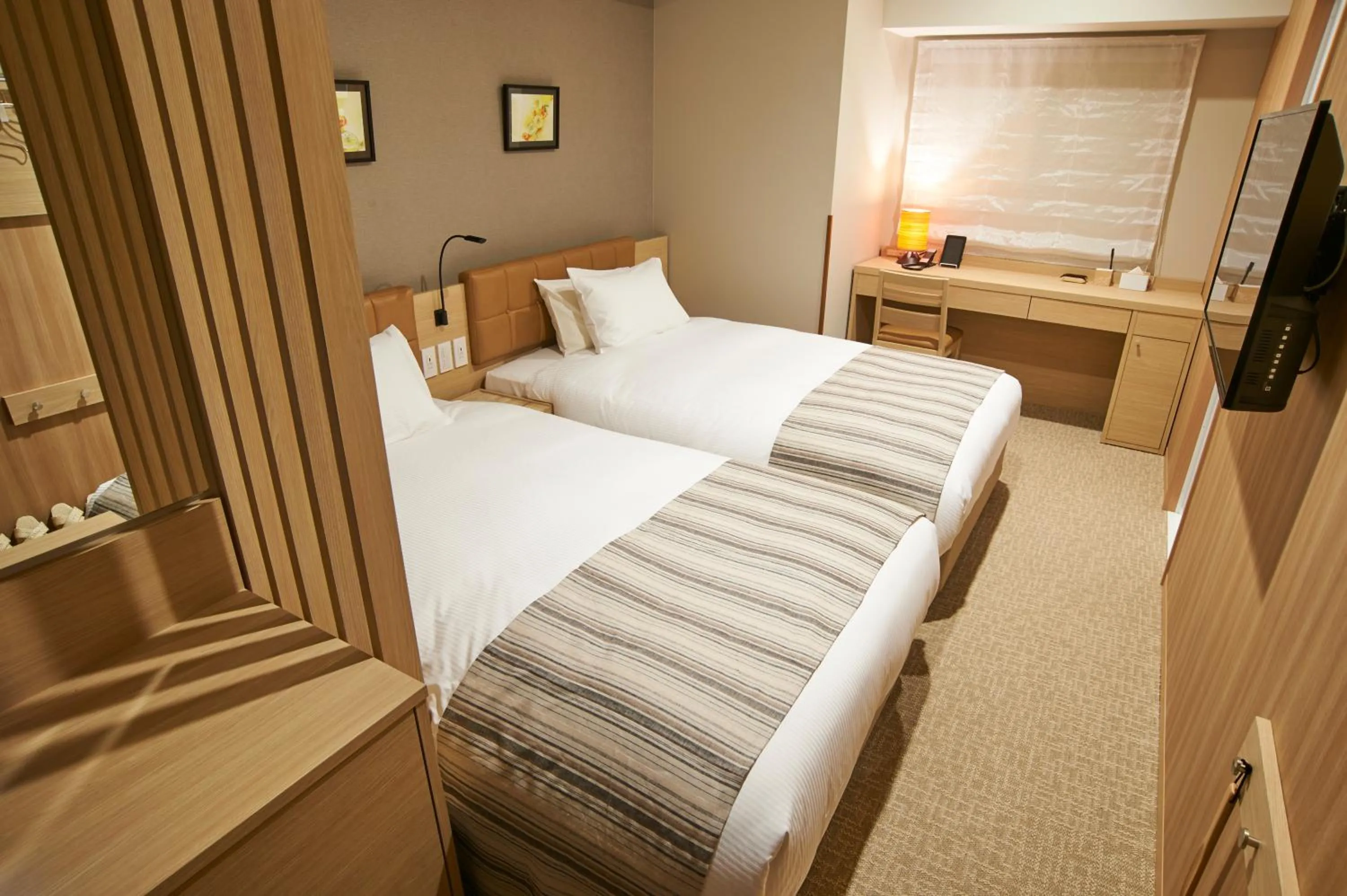 Bed in QuintessaHotel TokyoHaneda Comic&Books