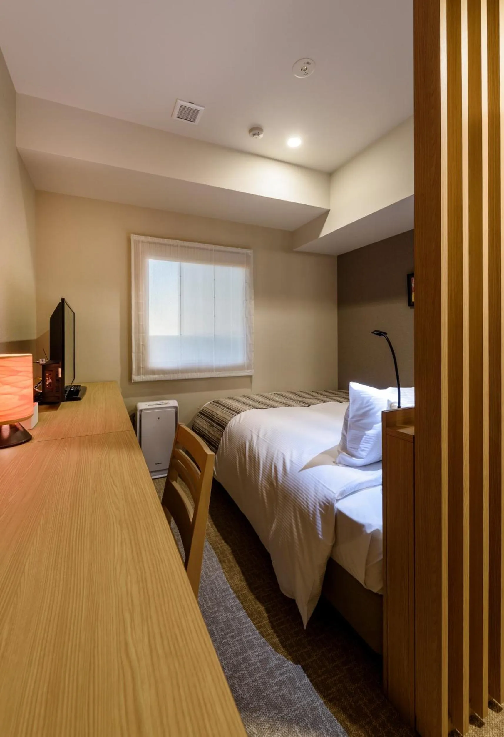 Bed in QuintessaHotel TokyoHaneda Comic&Books