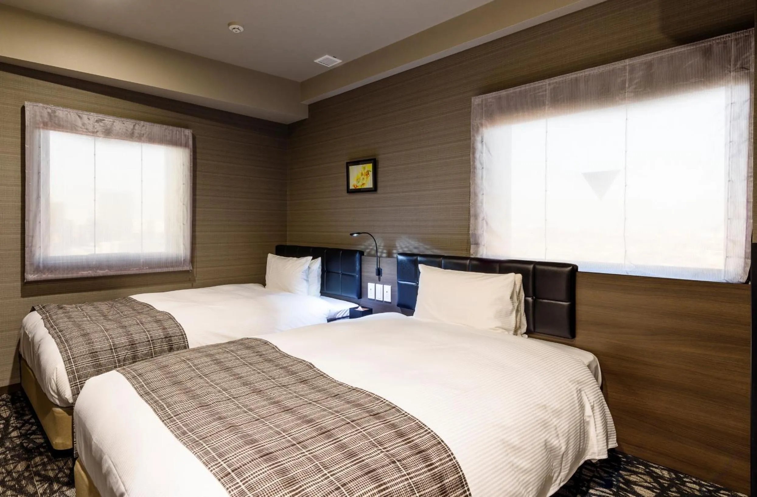 Bed in QuintessaHotel TokyoHaneda Comic&Books