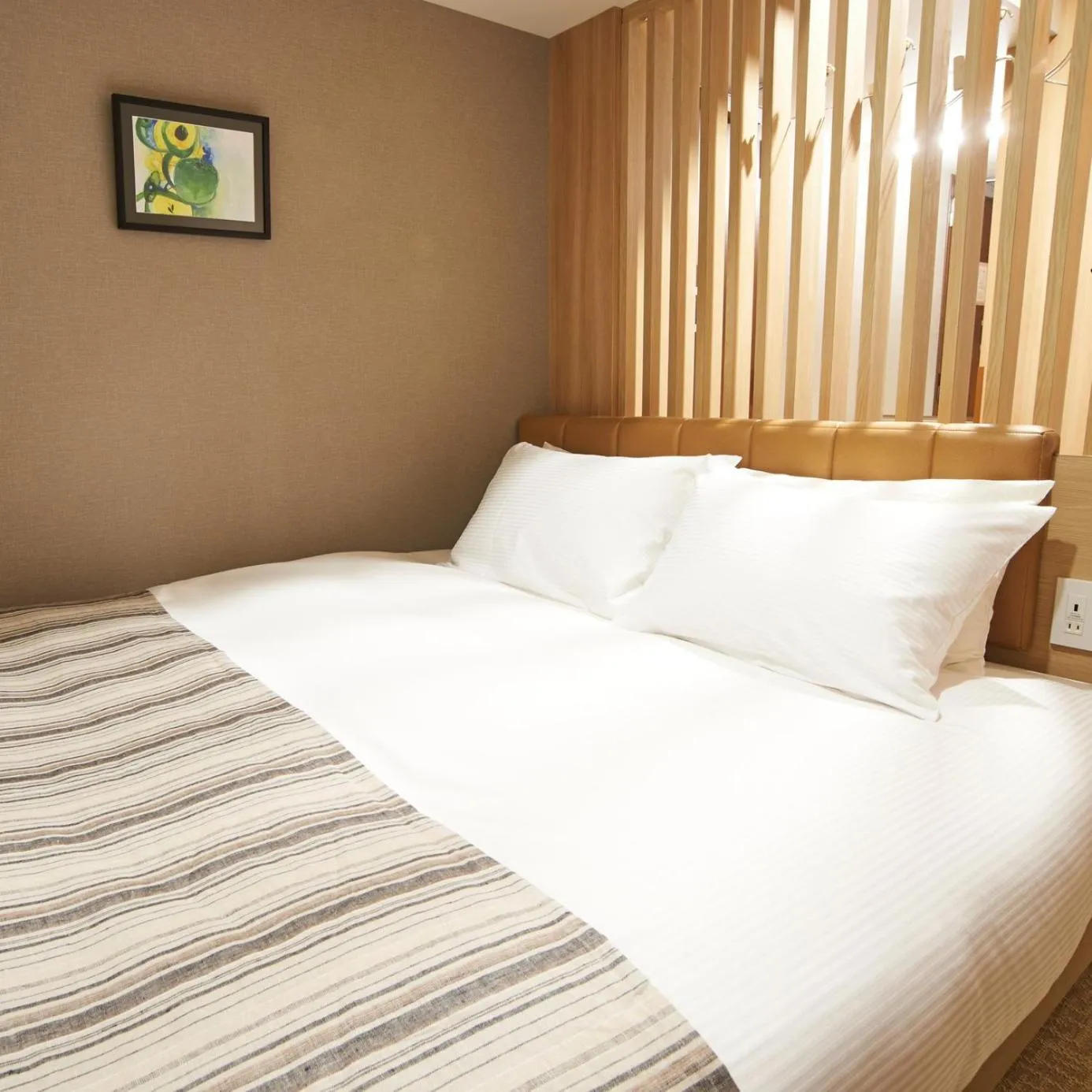 Bed in QuintessaHotel TokyoHaneda Comic&Books