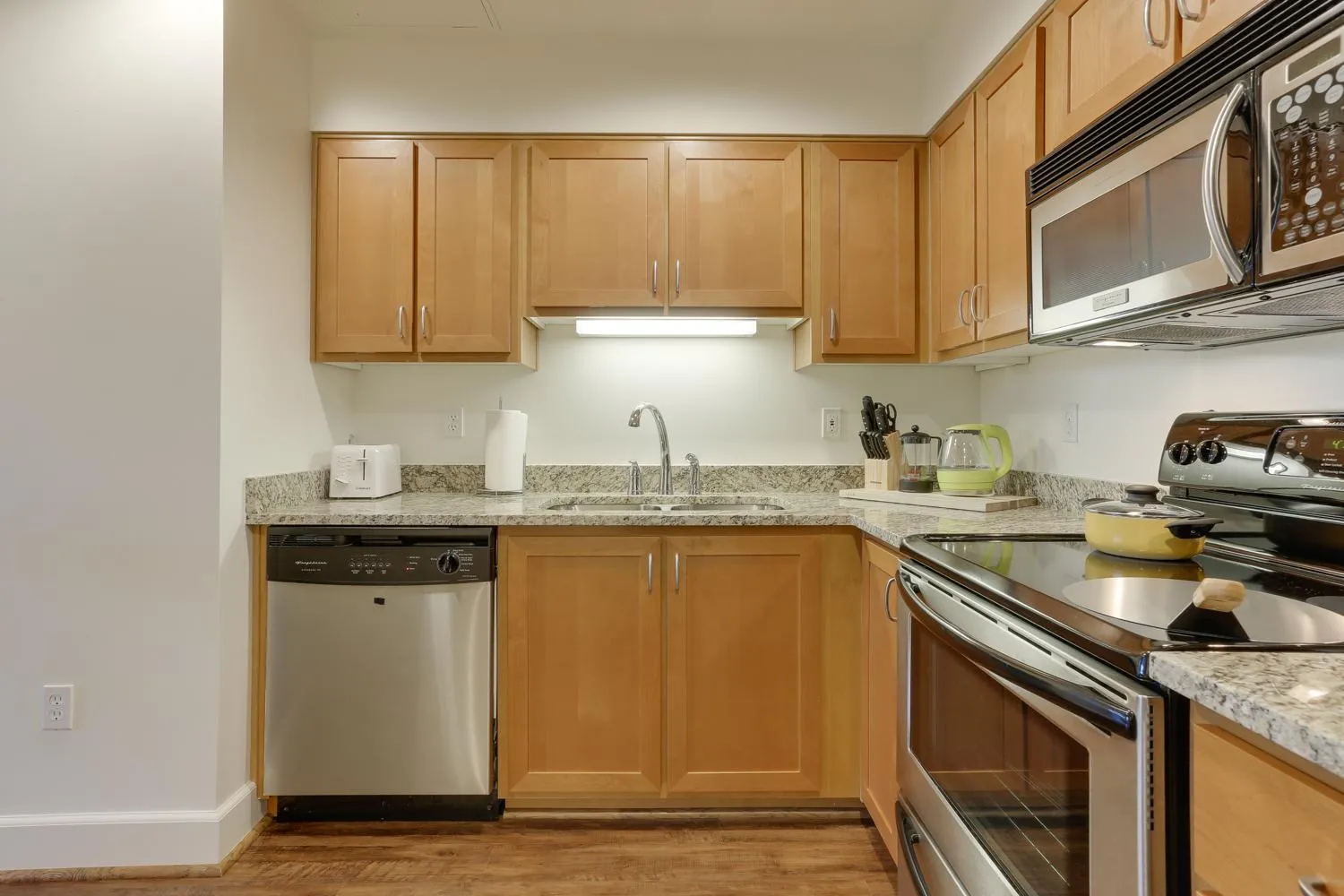 Kitchen or kitchenette in Renu Suites at The Burlington Portland