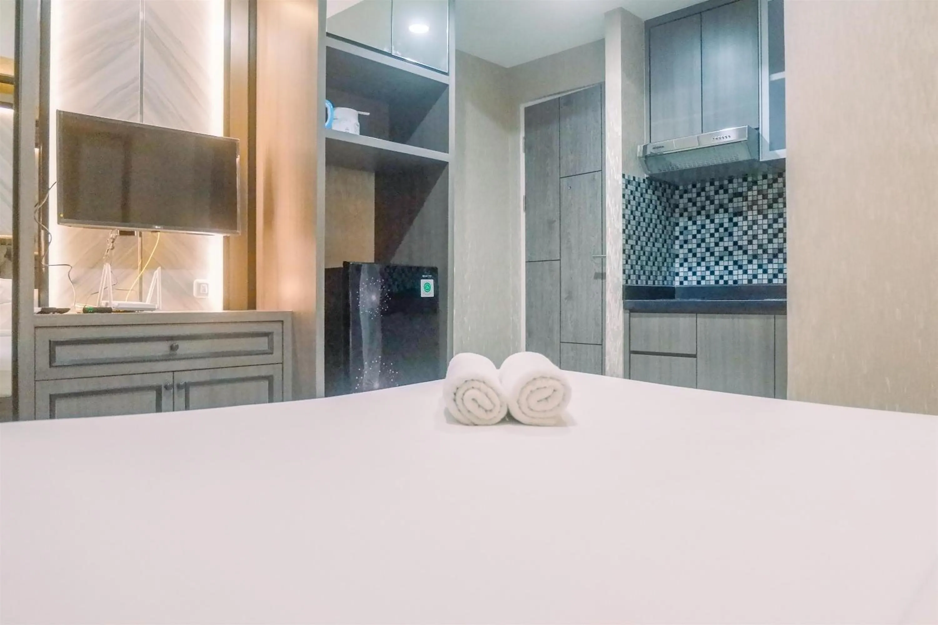 Bed in Classic Studio Room Apartment at Taman Melati Surabaya By Travelio