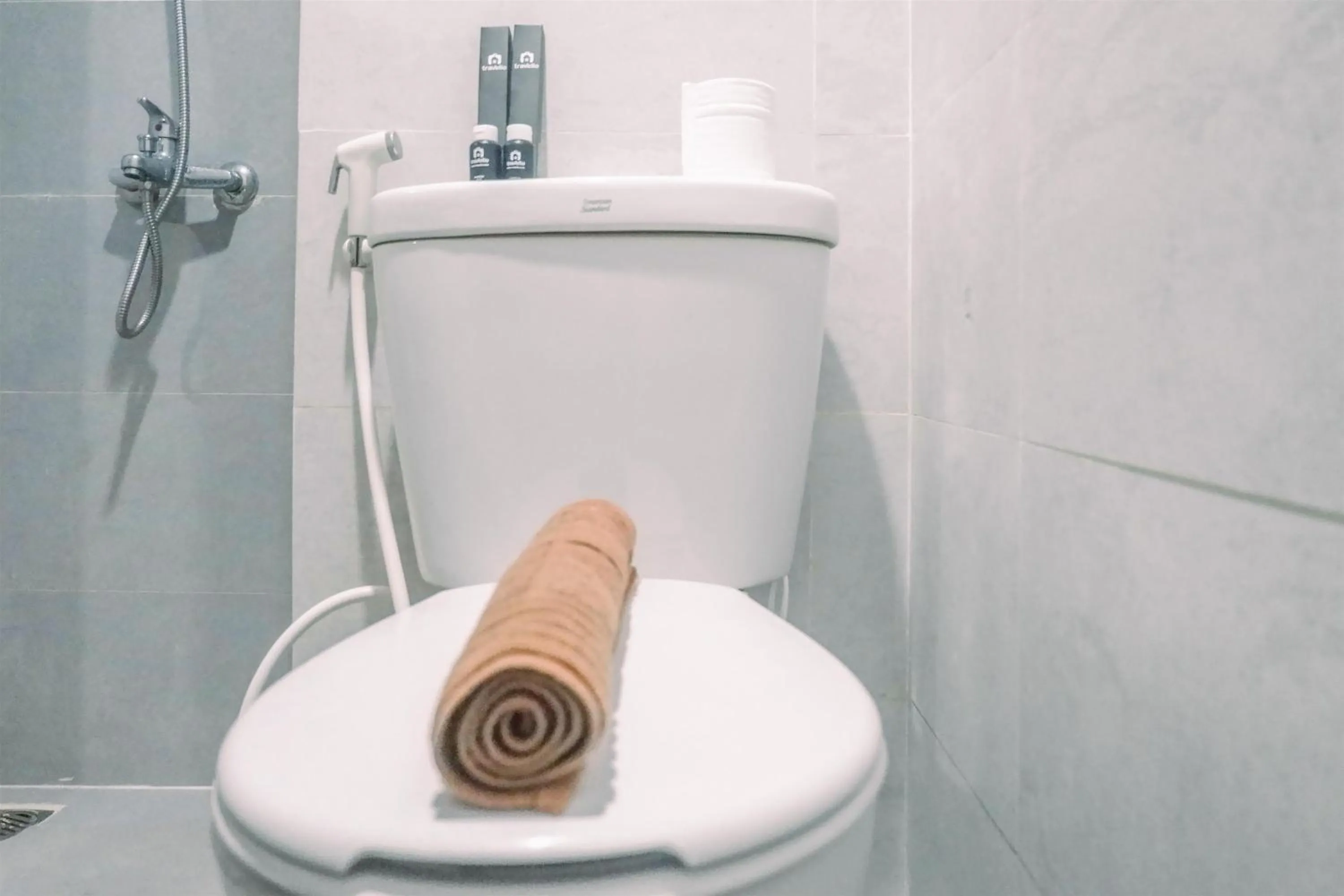 Bathroom in Classic Studio Room Apartment at Taman Melati Surabaya By Travelio