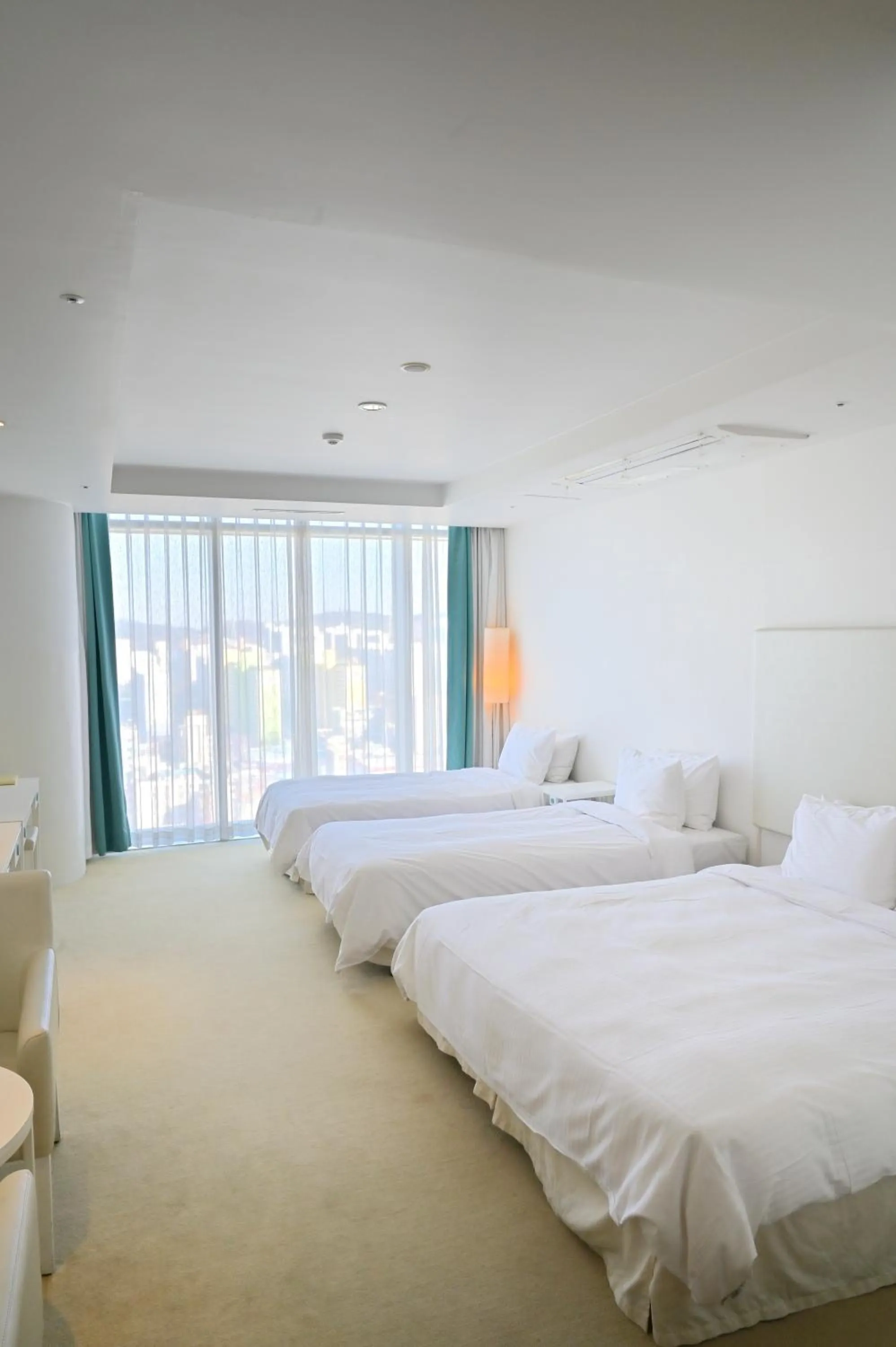 Bed in Ecograd Hotel