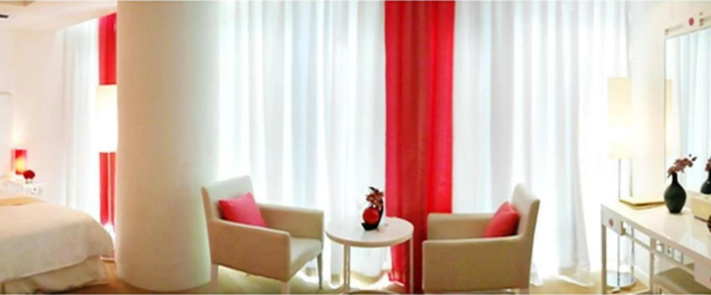 Bed in Ecograd Hotel