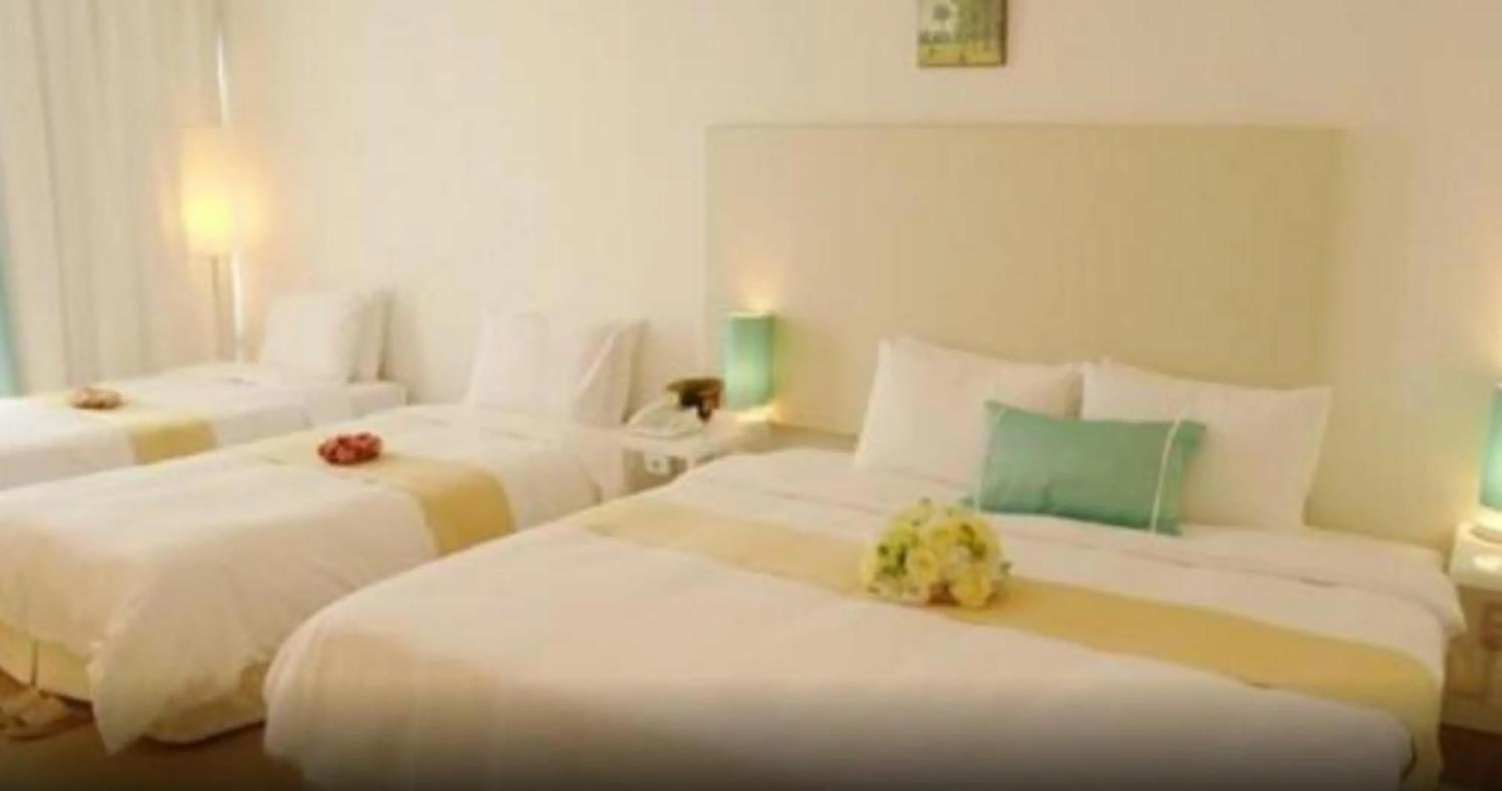 Bed in Ecograd Hotel