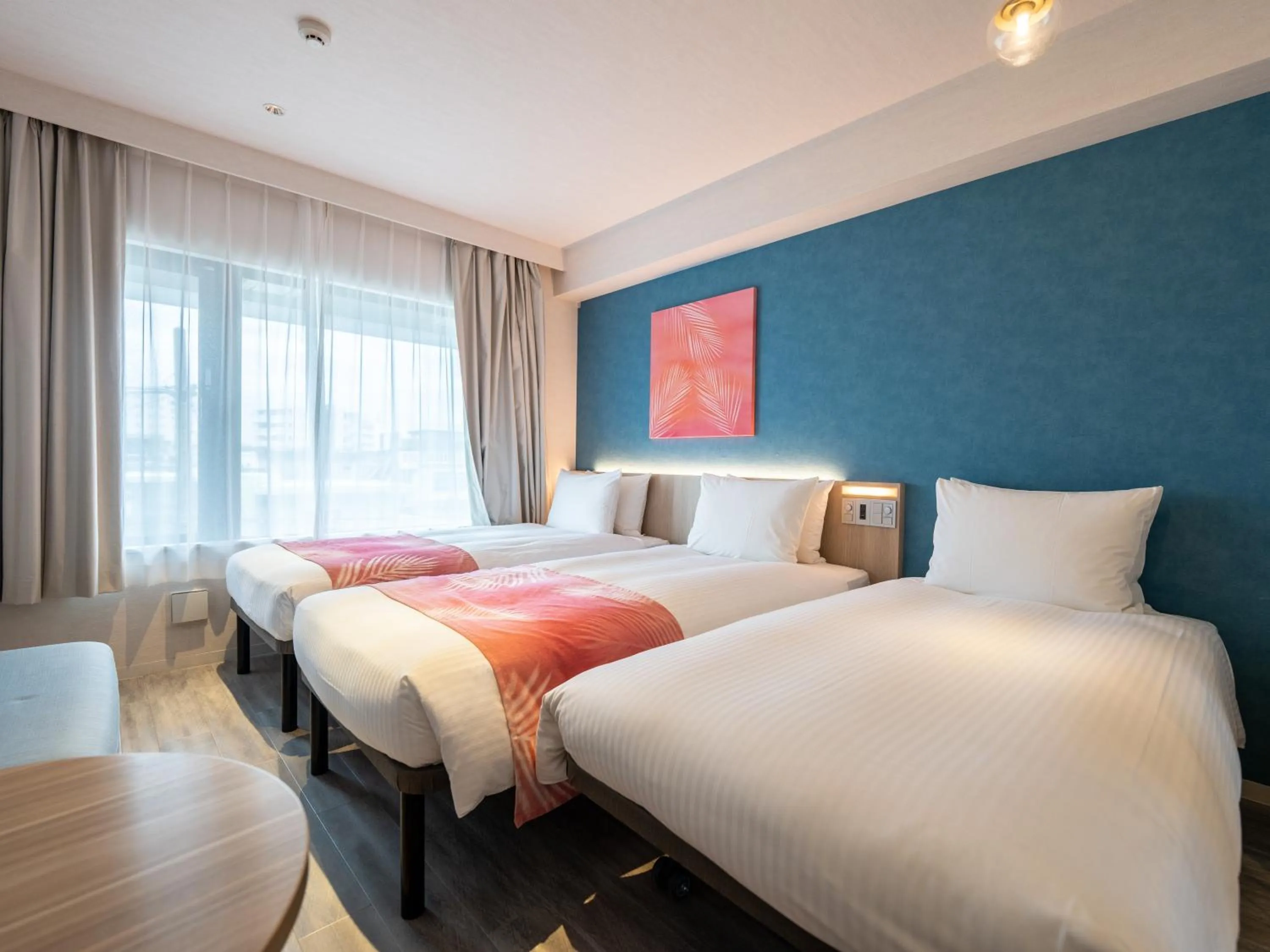 Photo of the whole room, Bed in Tabino Hotel lit Miyakojima