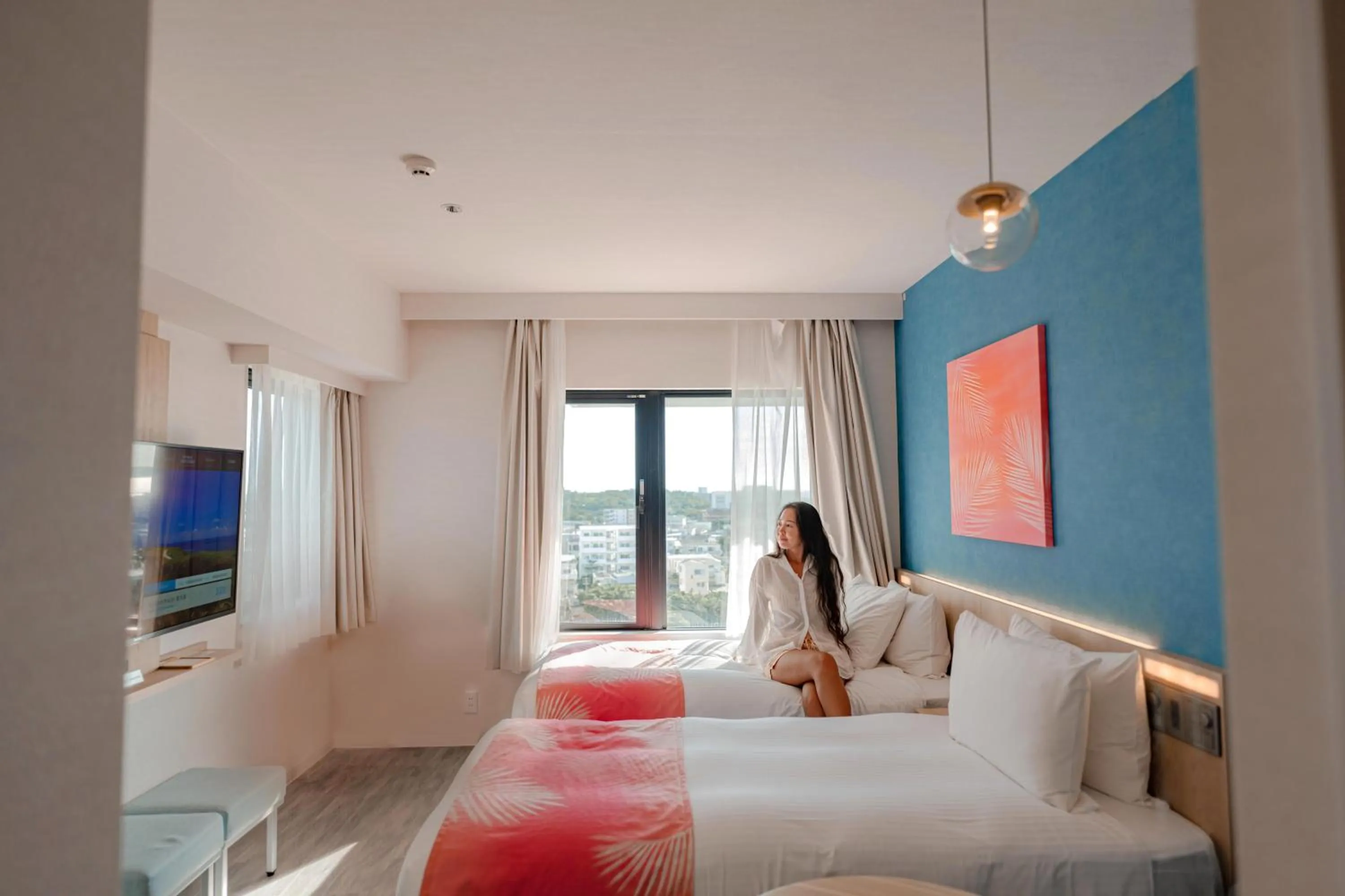 Photo of the whole room, Bed in Tabino Hotel lit Miyakojima