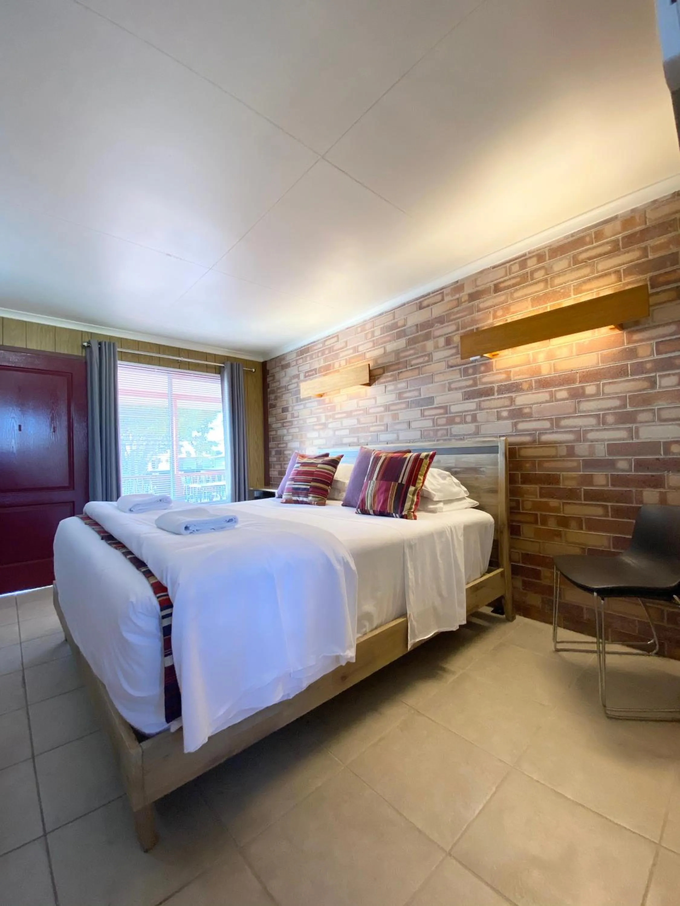 Bed in PROSERPINE MOTOR LODGE