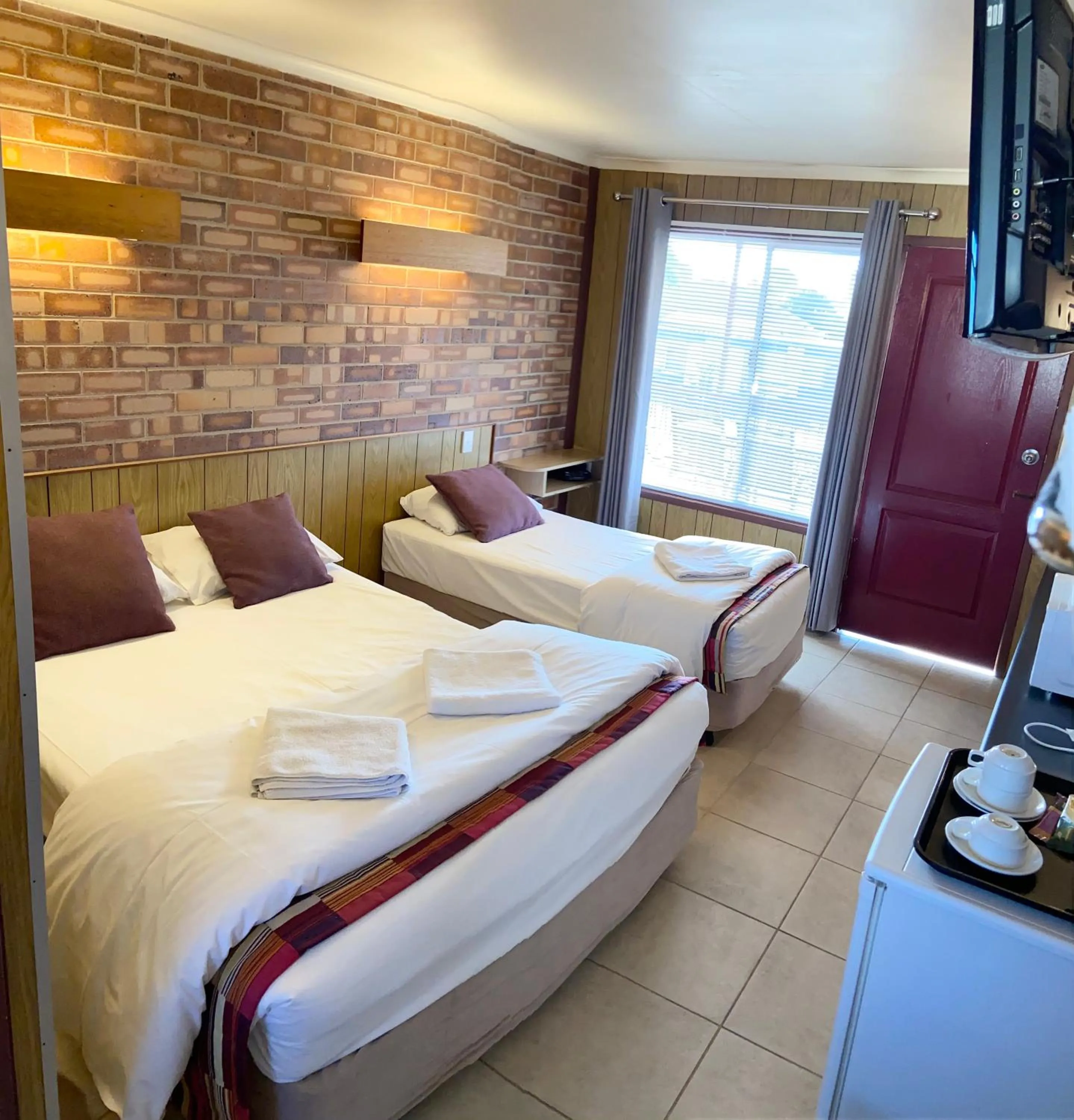 Bed in PROSERPINE MOTOR LODGE