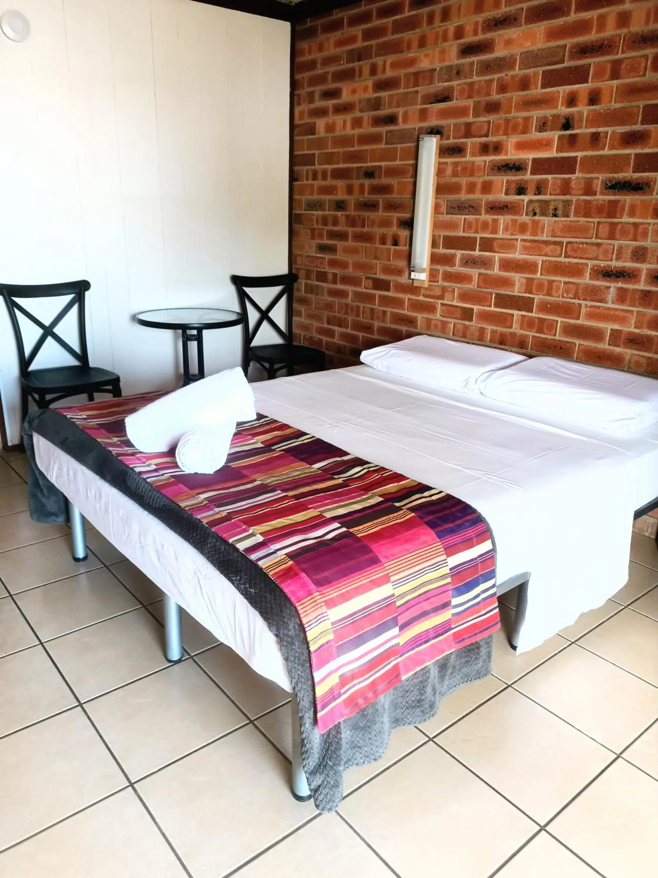 Bed in PROSERPINE MOTOR LODGE