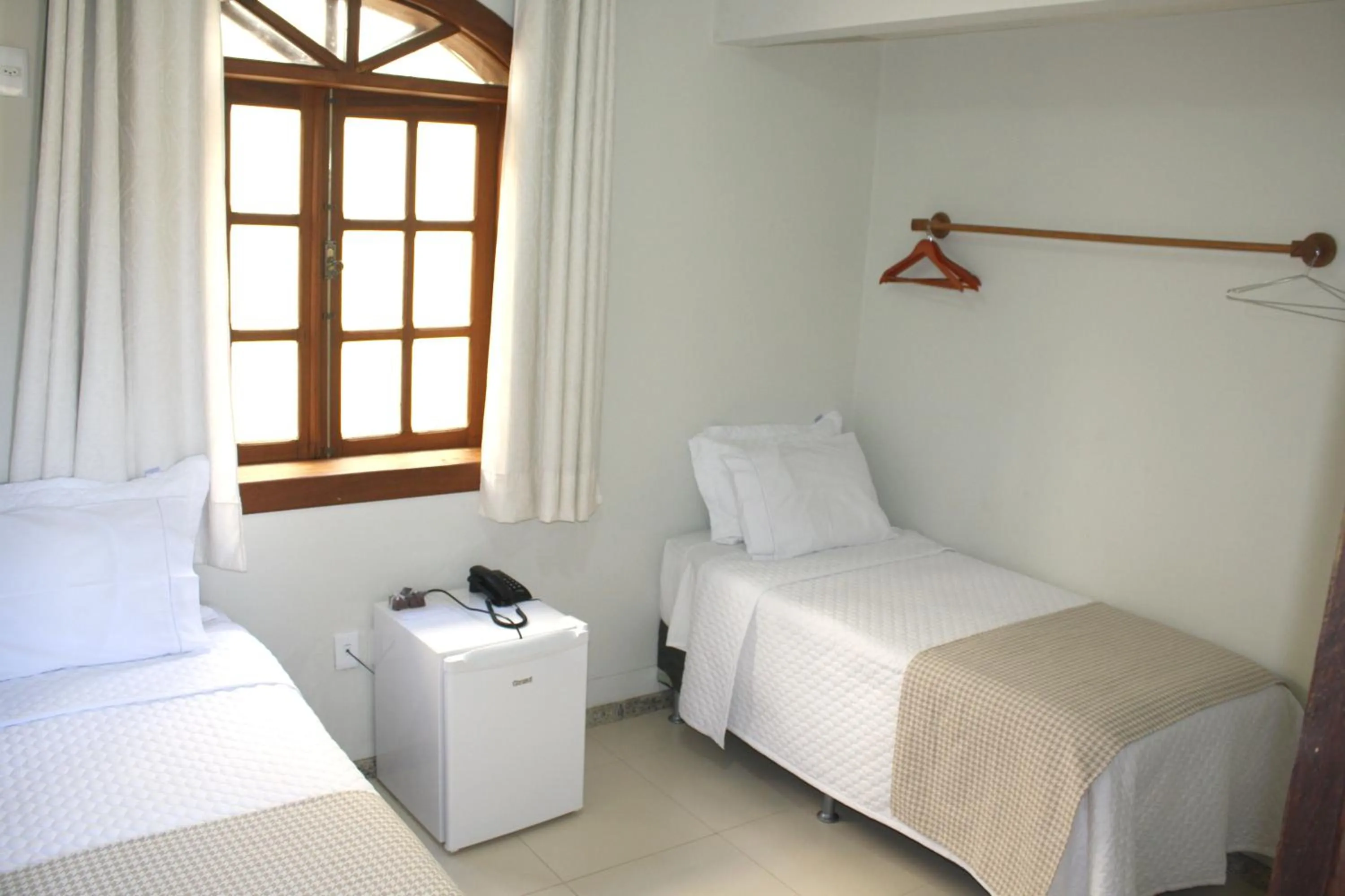 Bed in POUSADA CAPIM LIMÃO