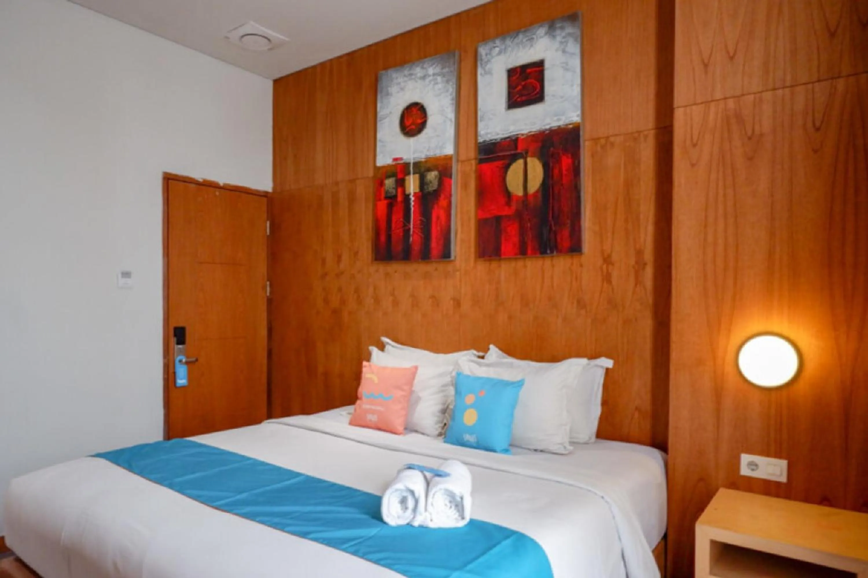 Bed in Sans Hotel Ekkon Yogyakarta by Reddoorz