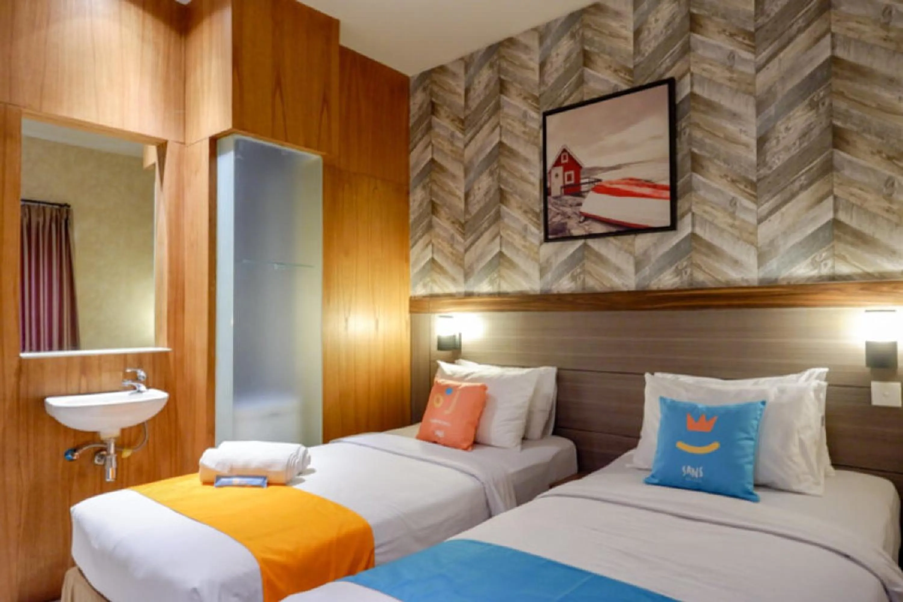 Bed in Sans Hotel Ekkon Yogyakarta by Reddoorz