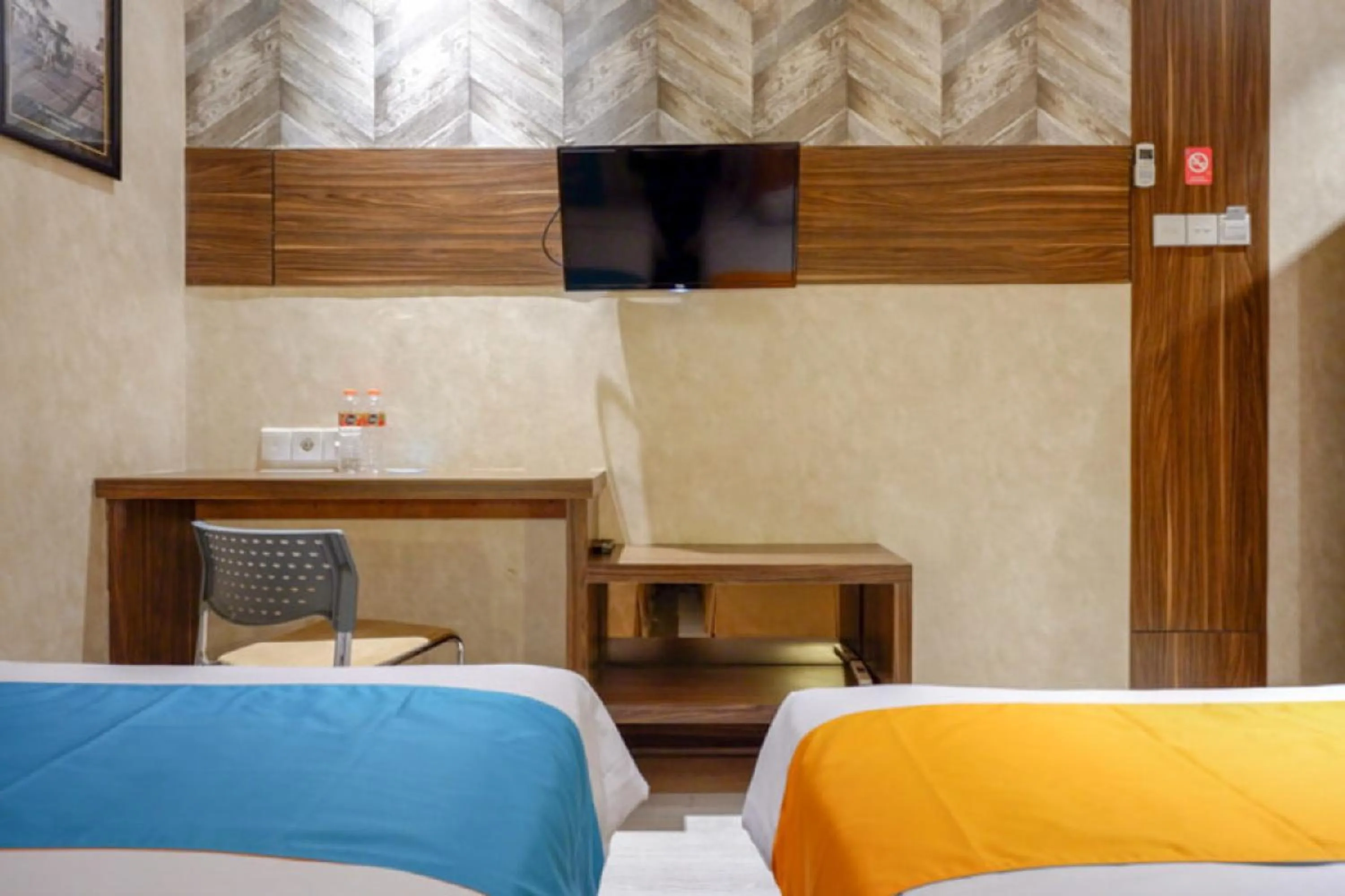 Bed in Sans Hotel Ekkon Yogyakarta by Reddoorz