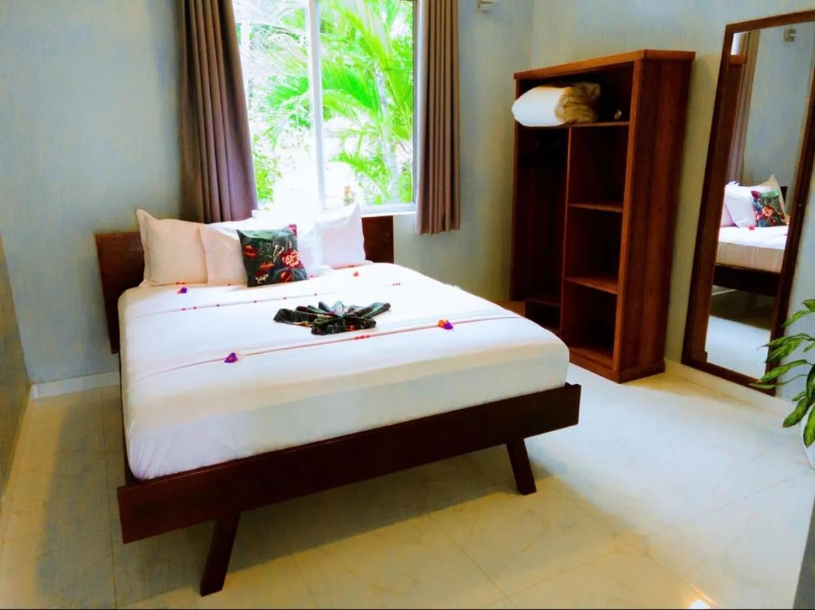 Bed in Calamari Beach Resort