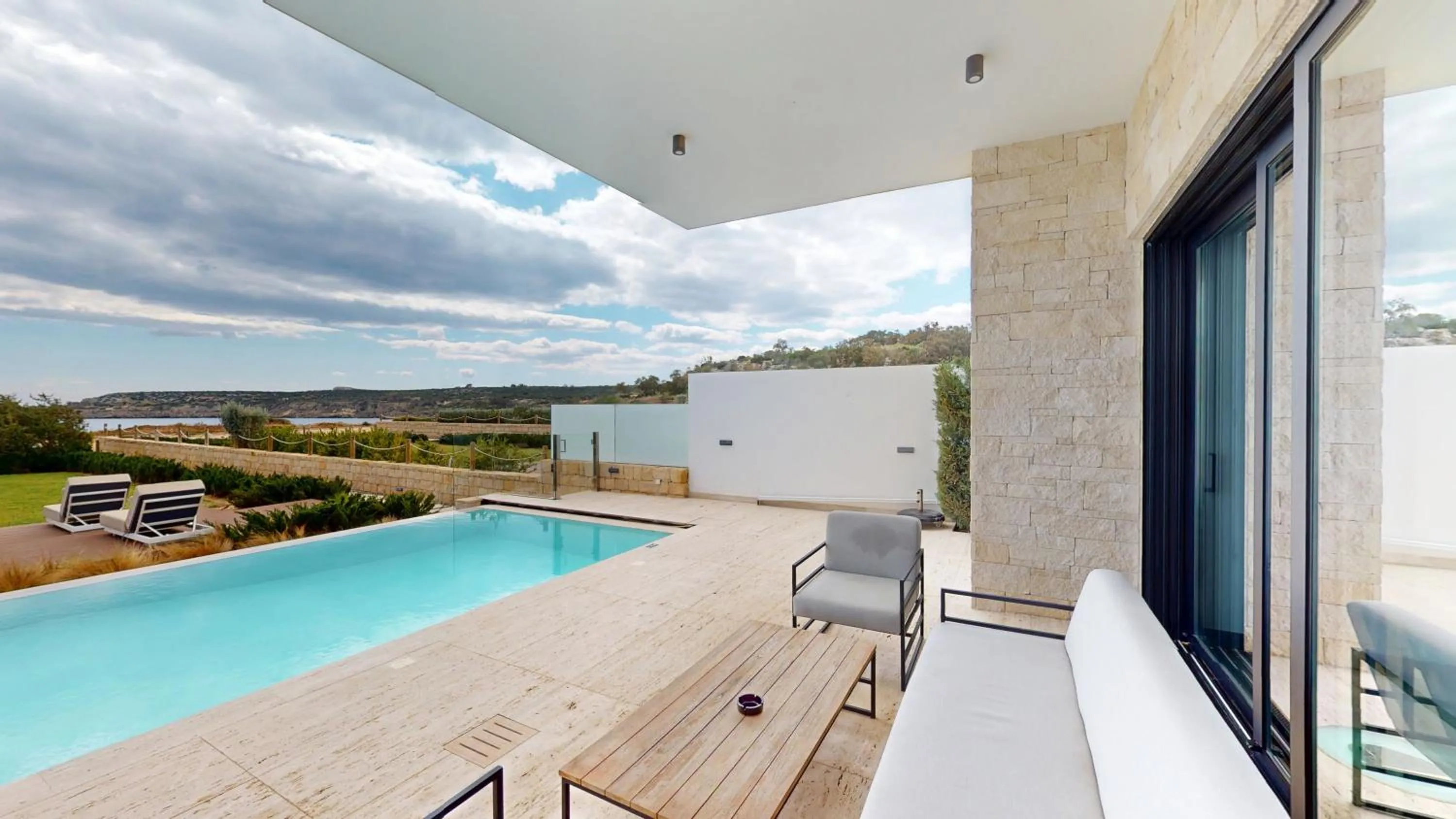 Seating area in Periyiali Konnos Villas Beach Resort