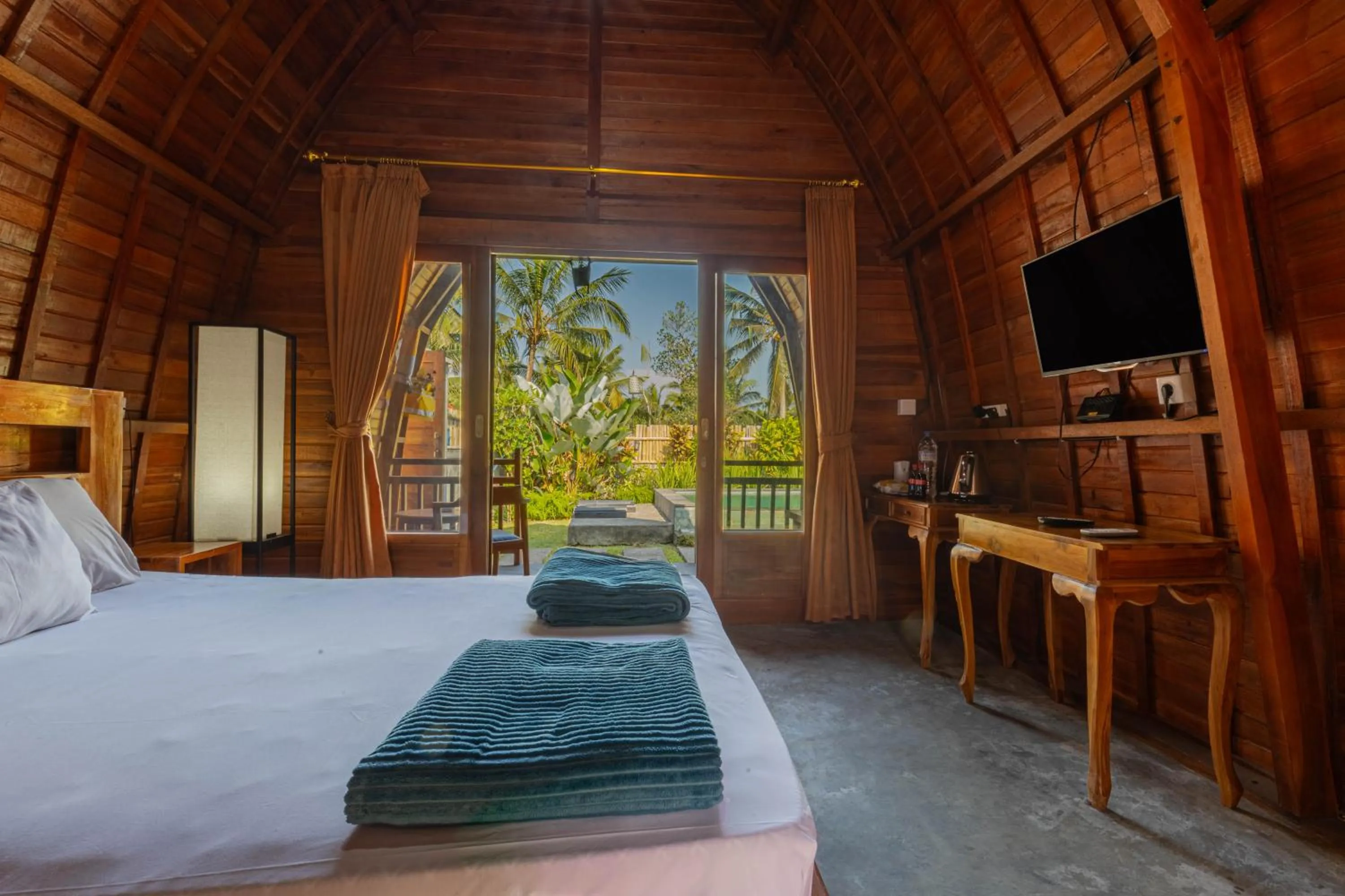 Bed in Kubu Selat Villa and Glamping