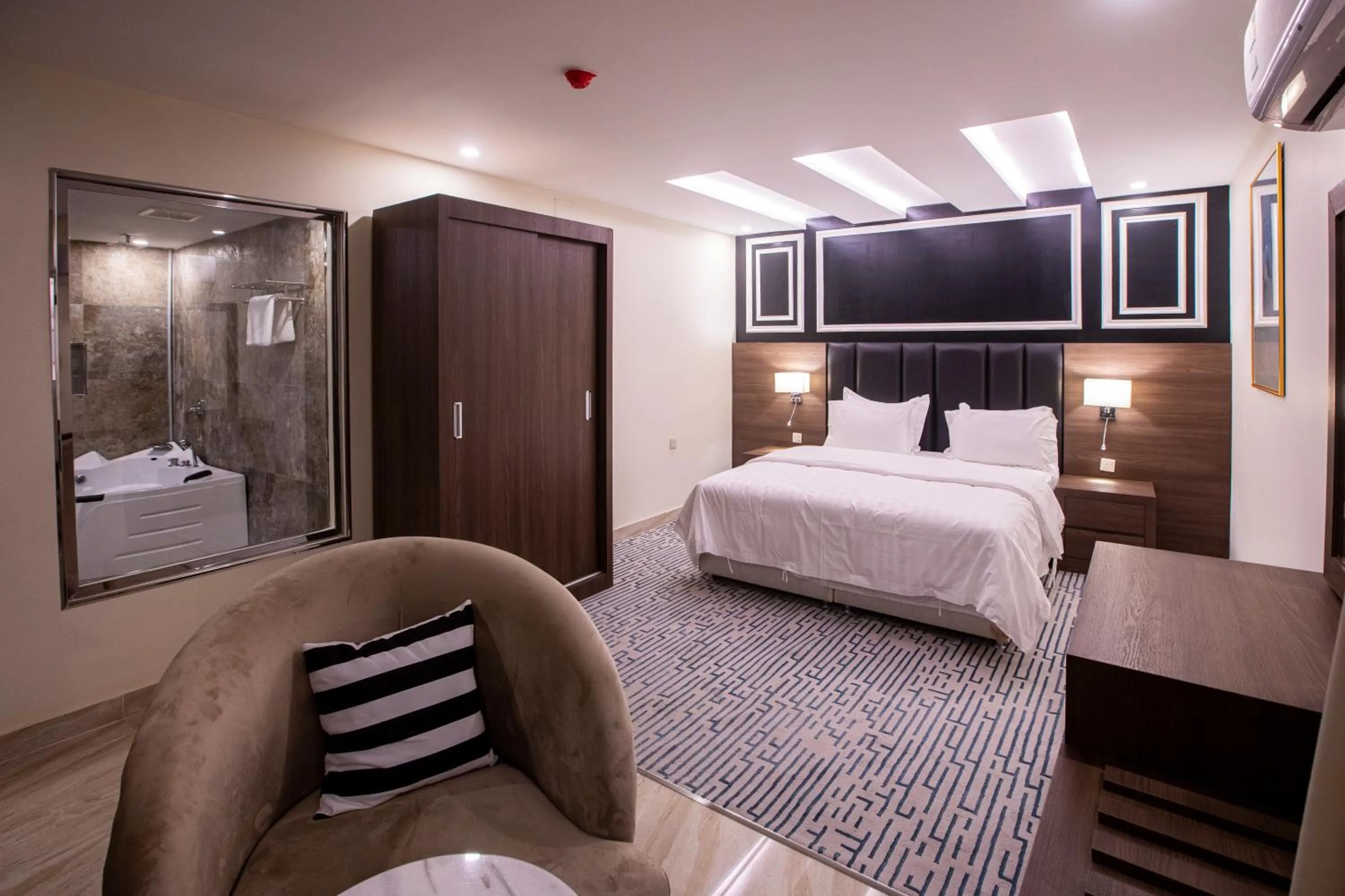 Bed in Olive Tree Hotel