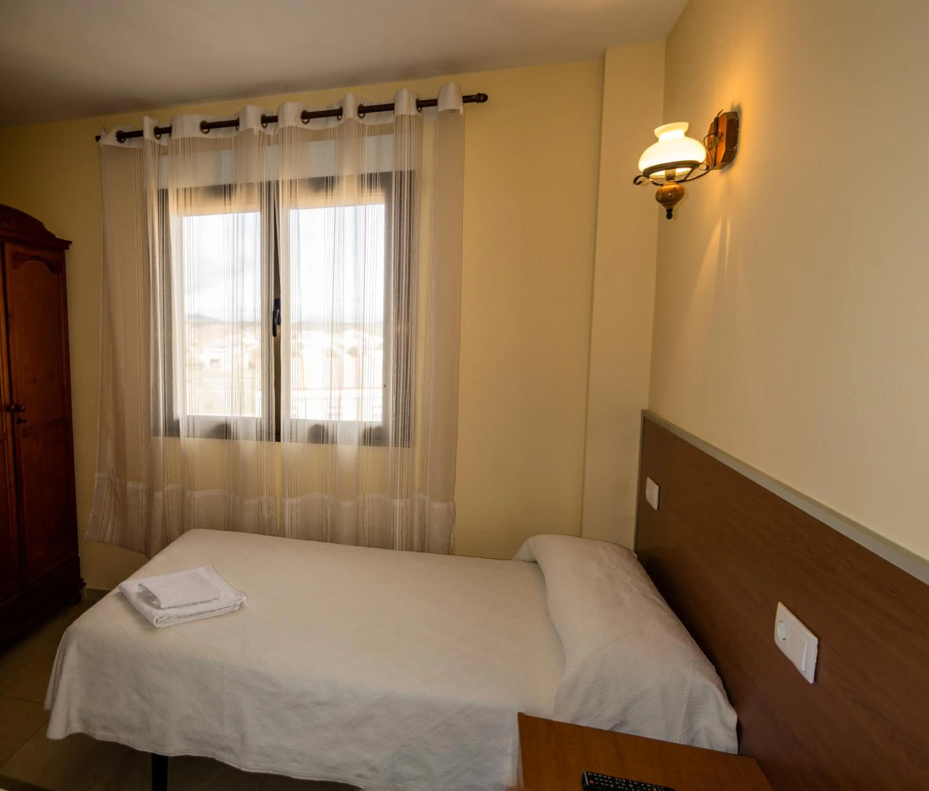 Bed in El Roble Hotel Restaurante