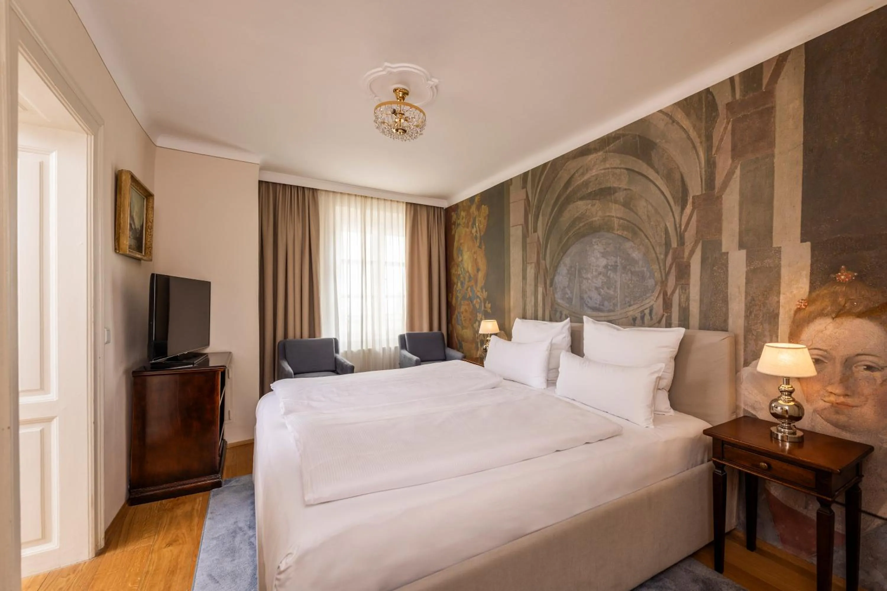 Bed in Boutiquehotel Amadeus