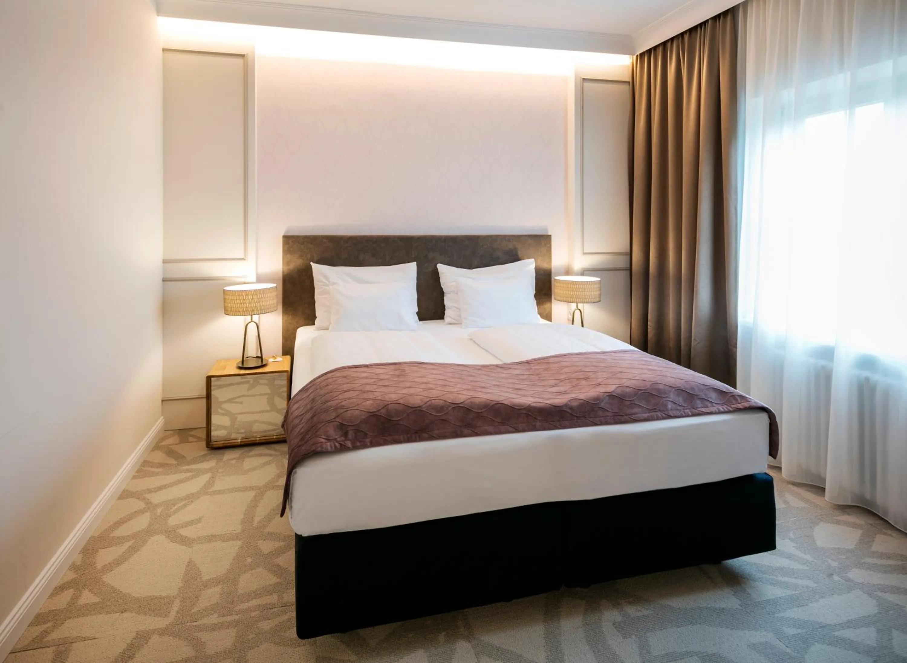 Bed in ARCOTEL Castellani Salzburg