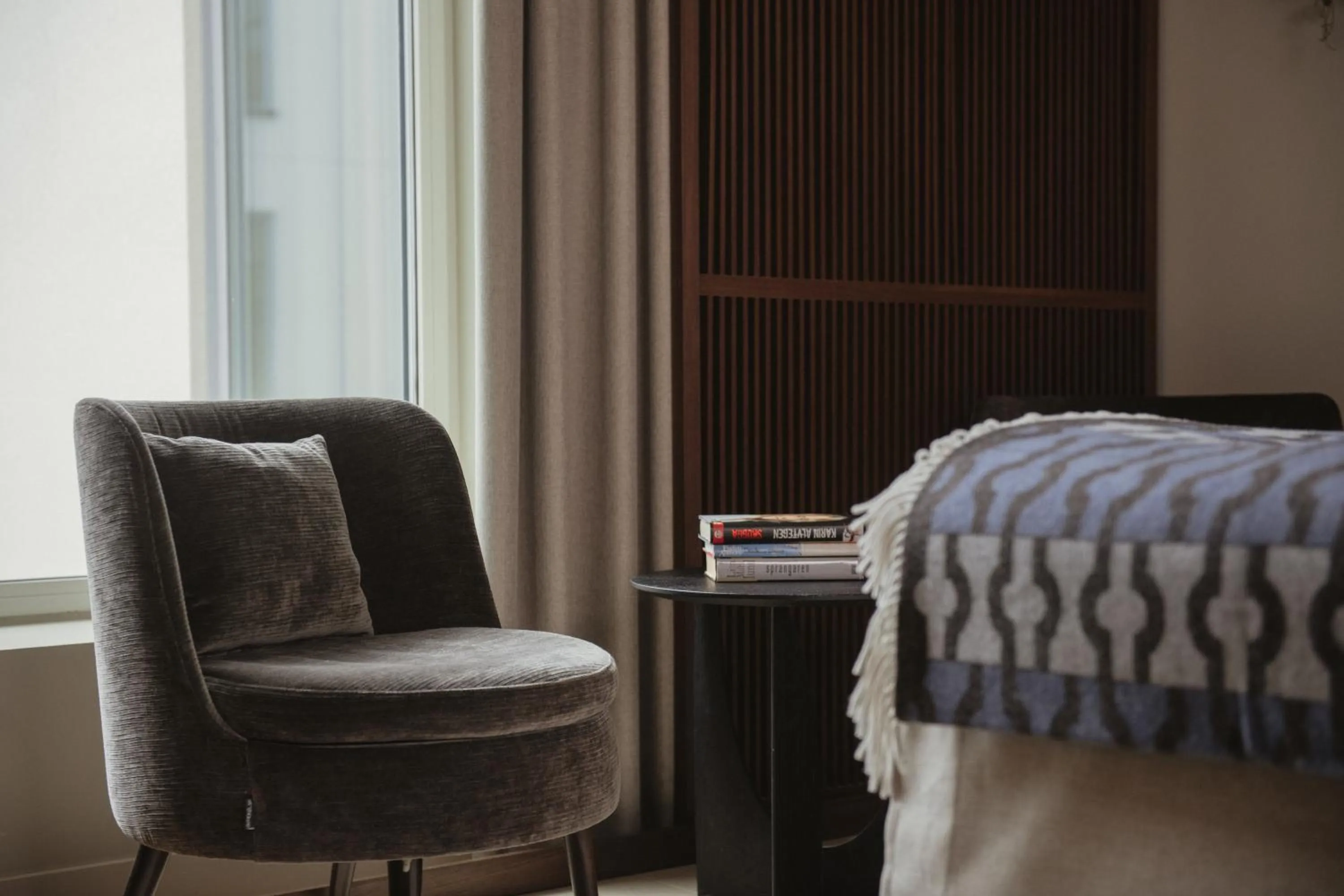 Seating area, Bed in Home Hotel Tapetfabriken